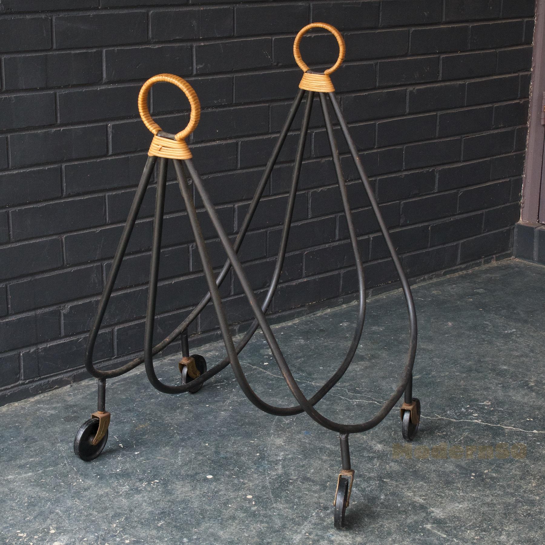 Iron cane and original canvas sling. If you remove the casters are optional, the height will lessen by 3 to 25 inches high. Wonderful design, has a French Modernist feel, like Jean Royere.