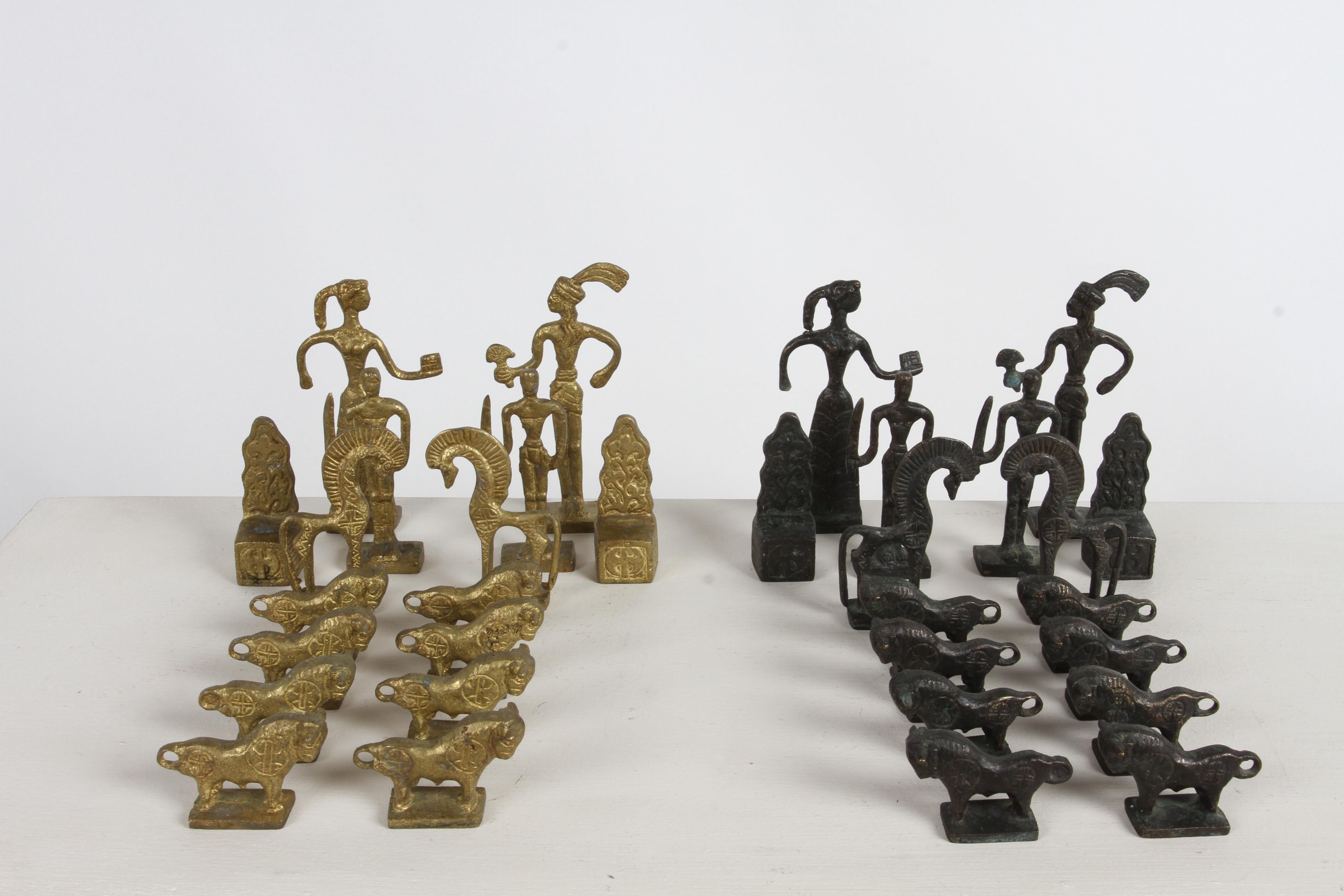 Rare handmade bronze complete chess set by Christoforus Sklavenitis, a famous Greek-Crete artist who was a student of Modigliani. The pieces were made with the lost-wax method, one side is natural bronze, the other oxidized, tallest being 5.5
