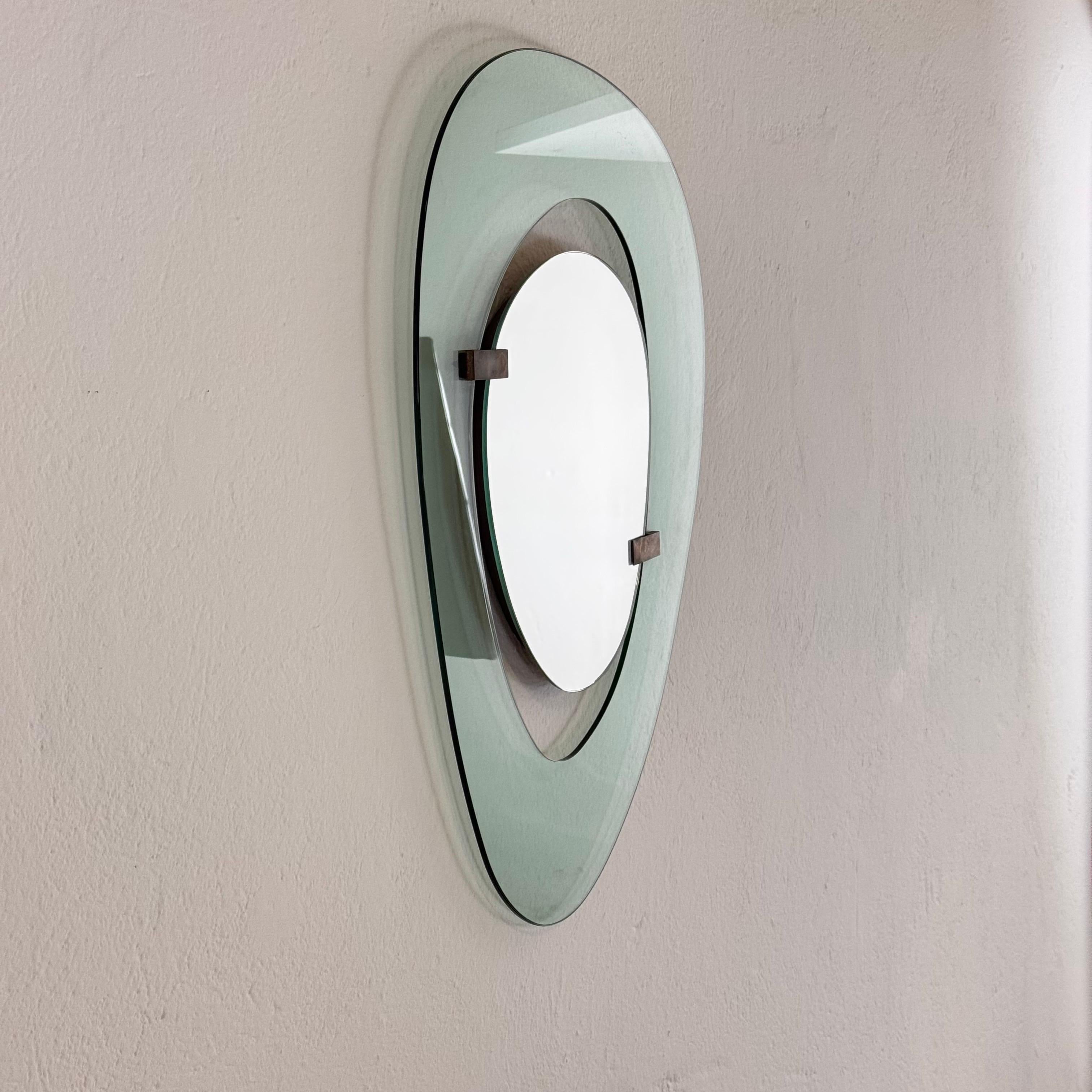 A rare and exquisite asymmetrical wall mirror designed by Max Ingrand for Fontana Arte in 1958, epitomizing the refined craftsmanship and innovation of mid-century Italian design.

This sculptural piece features Fontana Arte’s signature light blue