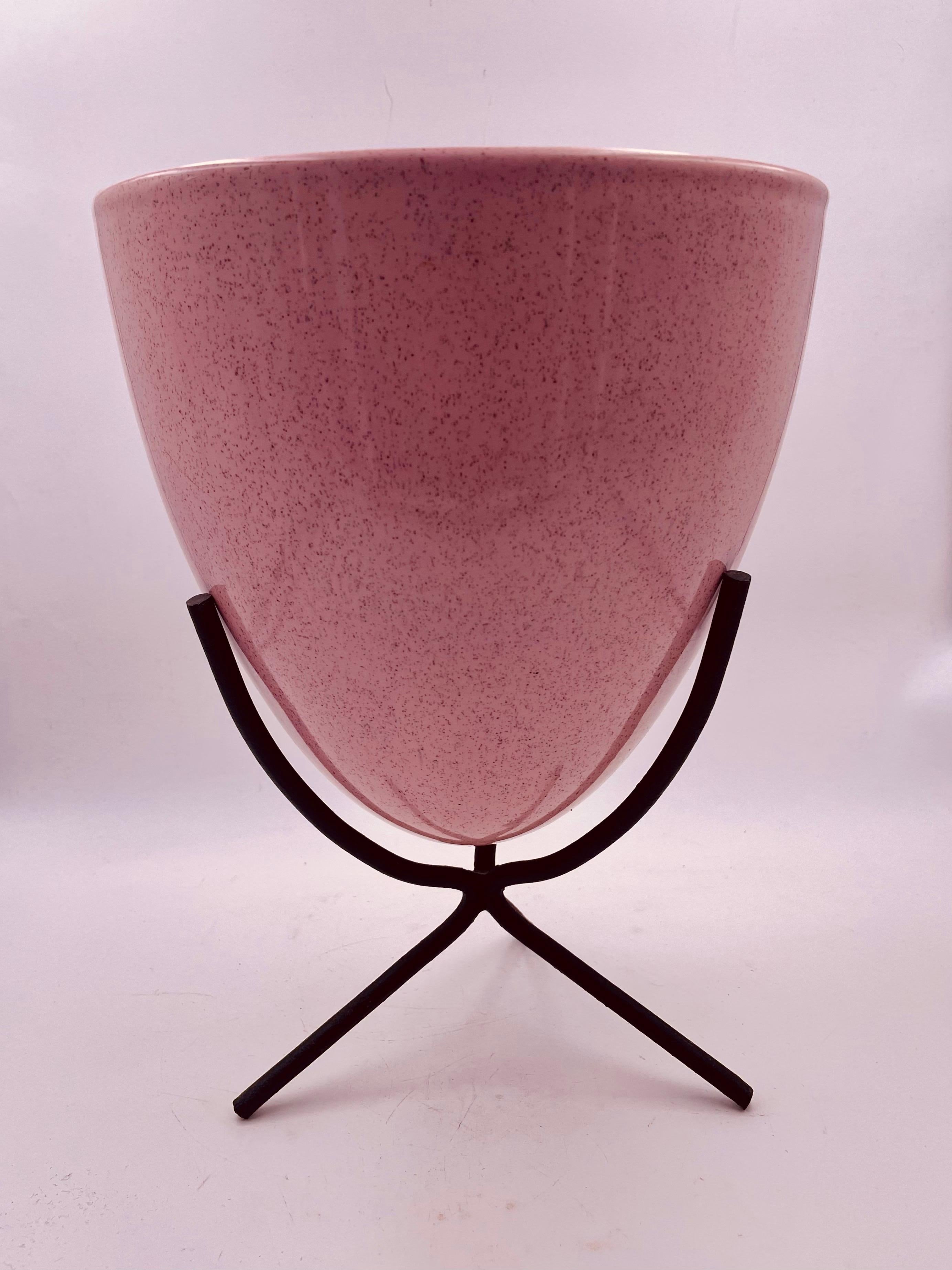 Rare atomic age ceramic planter with iron base and beautiful pink glaze with Spreckels, circa 1950's no chips or cracks only oxidation on the inside from dirt.