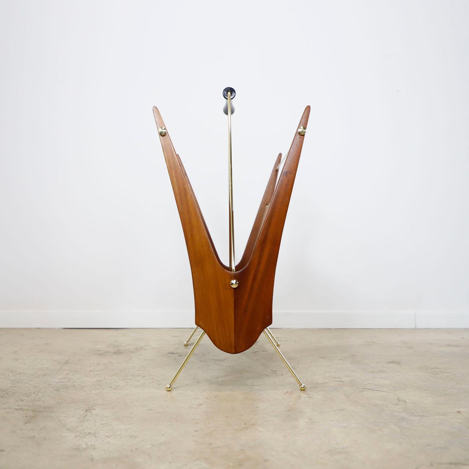 We offer this Rare Atomic Age Magazine Rack made in cedar wood and brass details, recently restored and the bronze pieces have been polished, circa 1950.