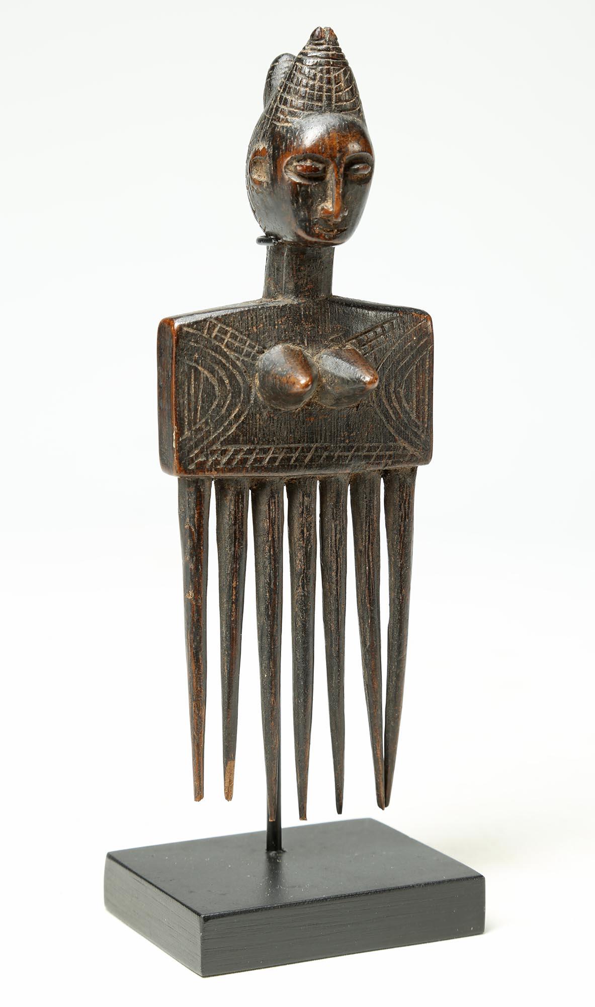 hair pick statue
