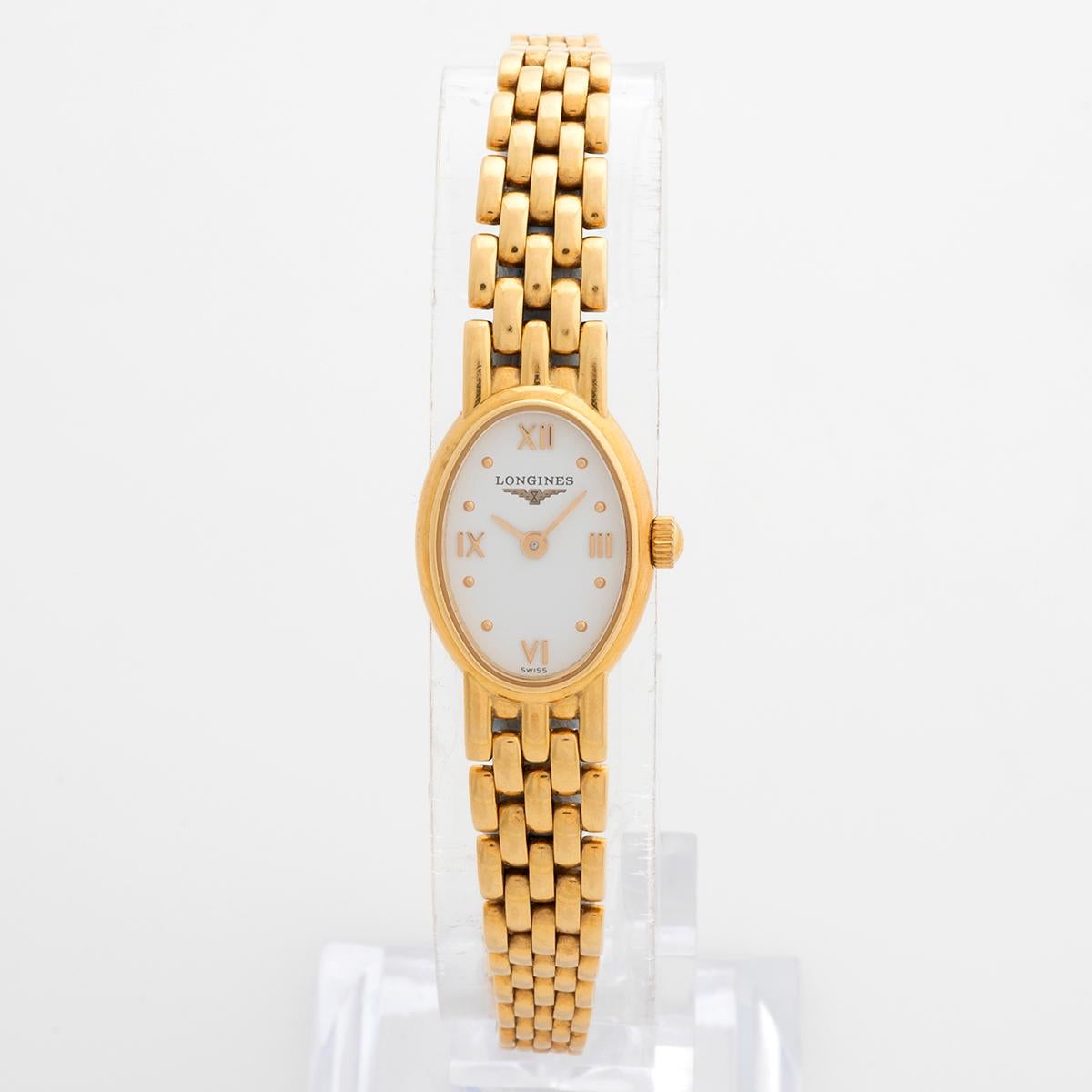 Our rare and attractive quartz Longines lady Prestige reference L6.109.6.15.6 features an 18k yellow gold oval 20mm case with white dial and 18k yellow gold bracelet with the clasp also hallmarked. We date this Longines to circa 2010. A wonderful