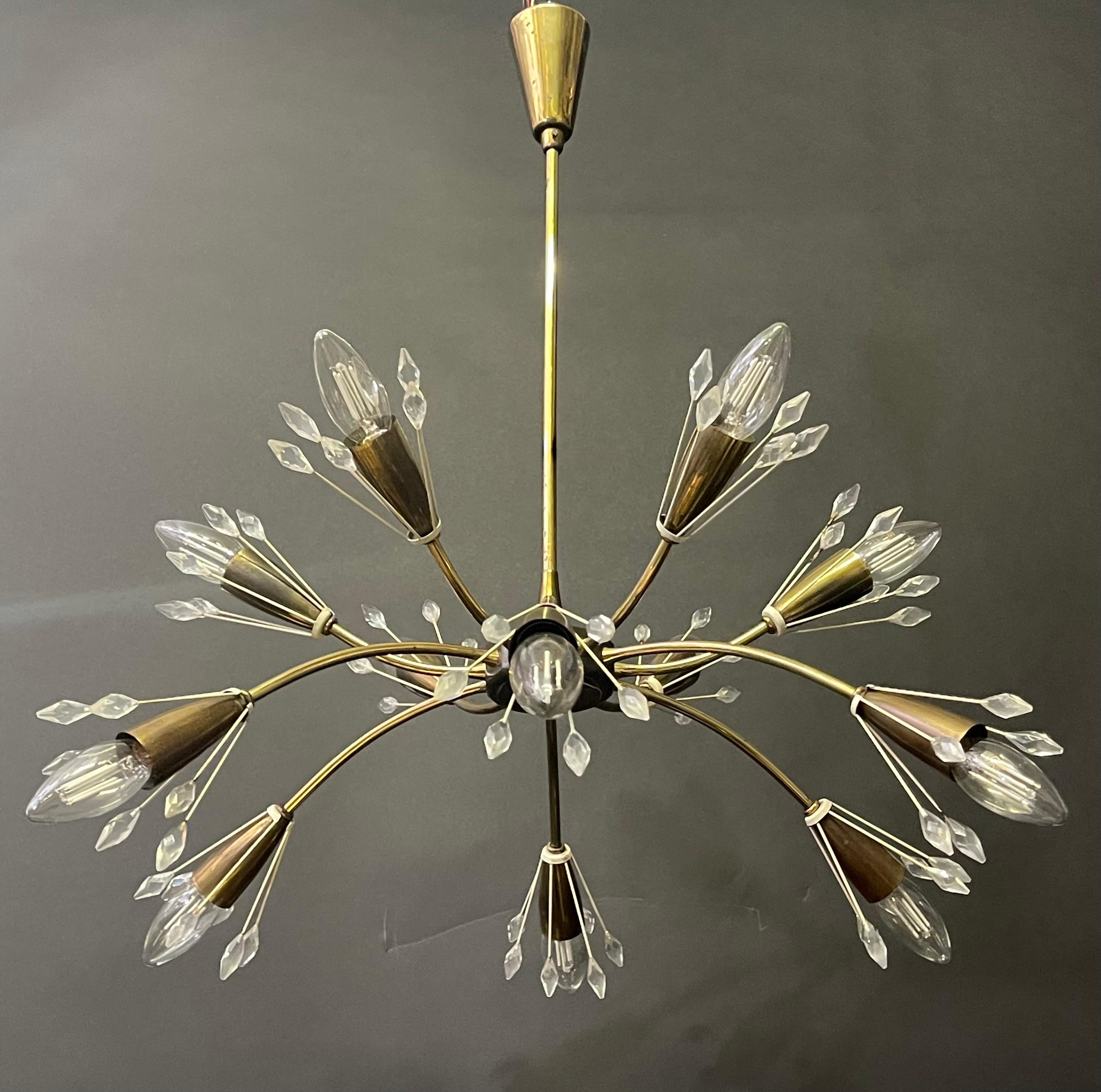 Rare mid - century polished and lacquered brass and metal 12 -arms chandelier by Rupert Nikoll, Austria, circa 1950s.

Socket: 12 x e14 for standard screw bulbs.

Pair of matching wall sconces are available*


