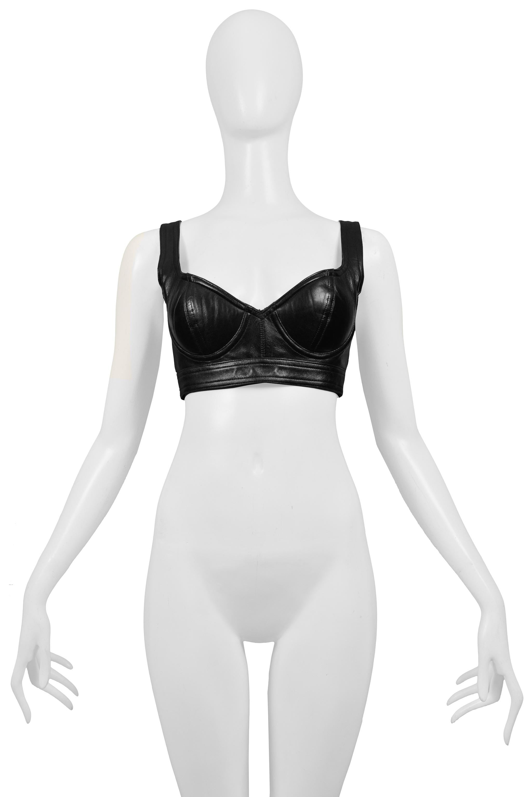 Resurrection Vintage is excited to offer an iconic vintage Azzedine Alaia black leather bra top featuring sculpted bra cups, a lined and padded interior, adjustable back straps with buckles

Azzedine Alaia Paris
Size 40
Leather
Excellent Vintage