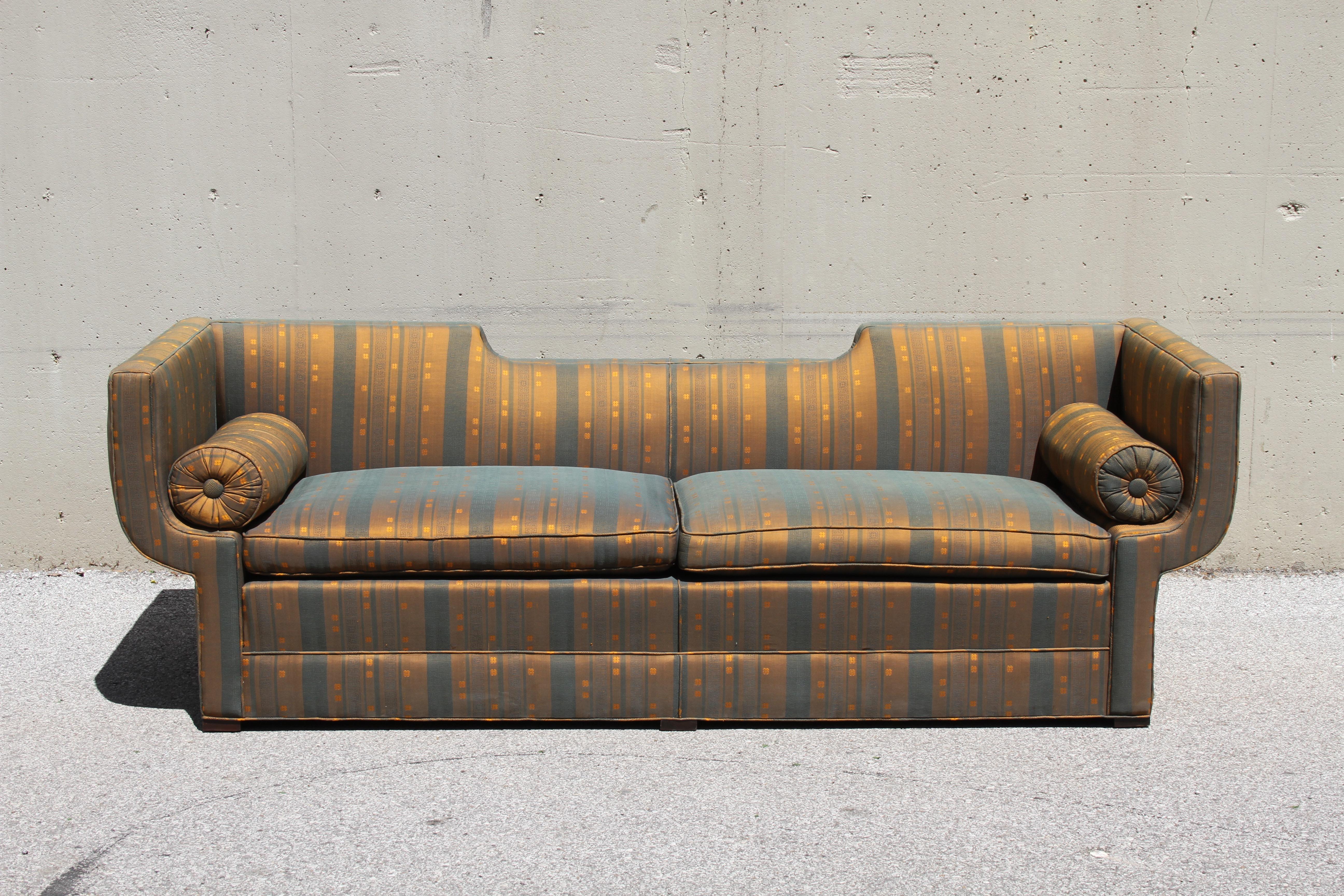 Rare Baker Furniture Co. sculptural Gondola sofa with original striped silk fabric, circa 1960. This elegant sofa is from a one owner estate of an artist, that was filled with Baker, Harvey Probber, Kelvin & Laverne and other midcentury furniture.