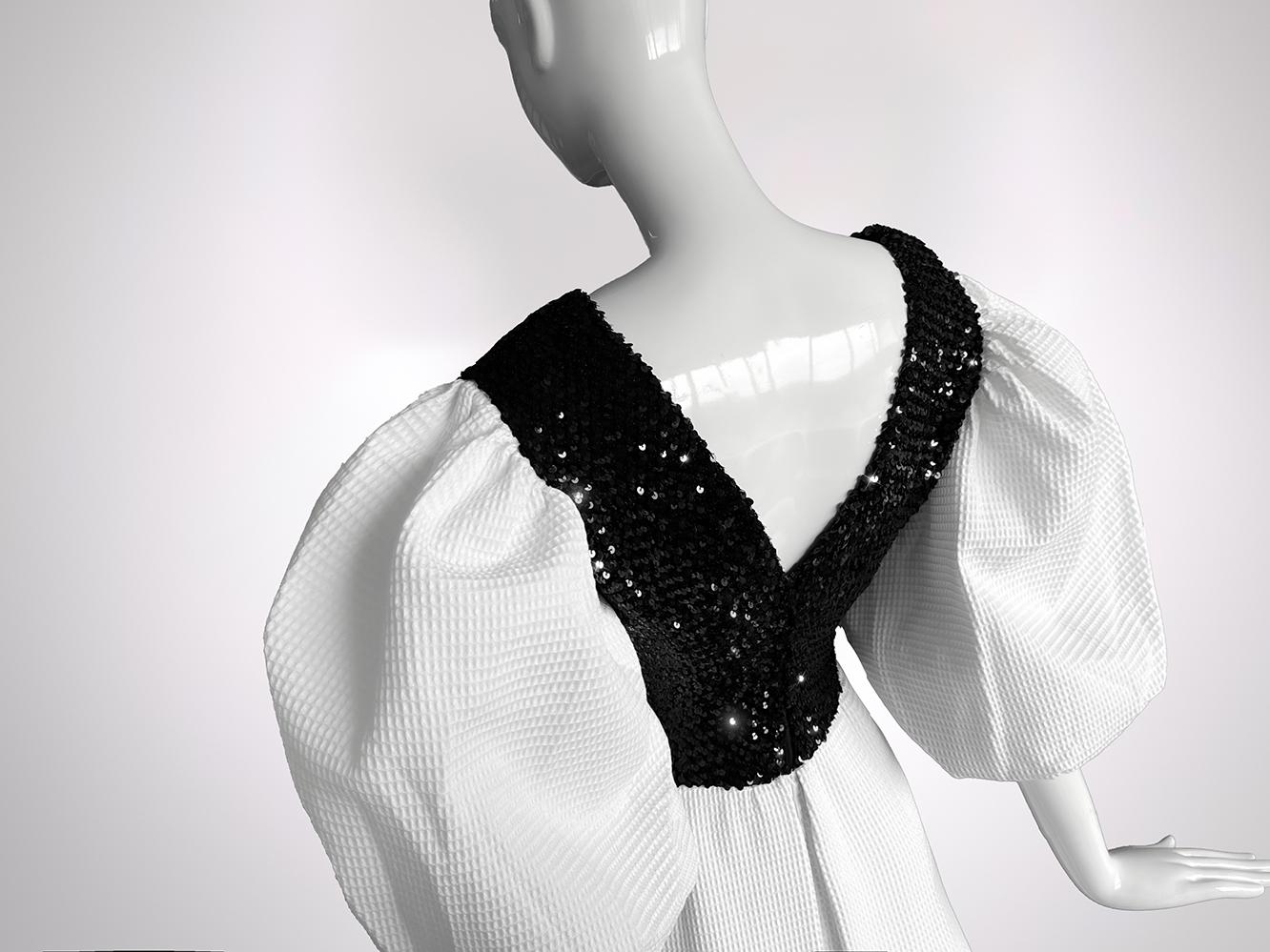 This Balenciaga gown, assuming late 1970s, with its celestial proportions and architectural poetry, is a quietly radical statement that echoes the very soul of the maison’s vision: pure, sculptural, and entirely uncompromising.
A symphony in black