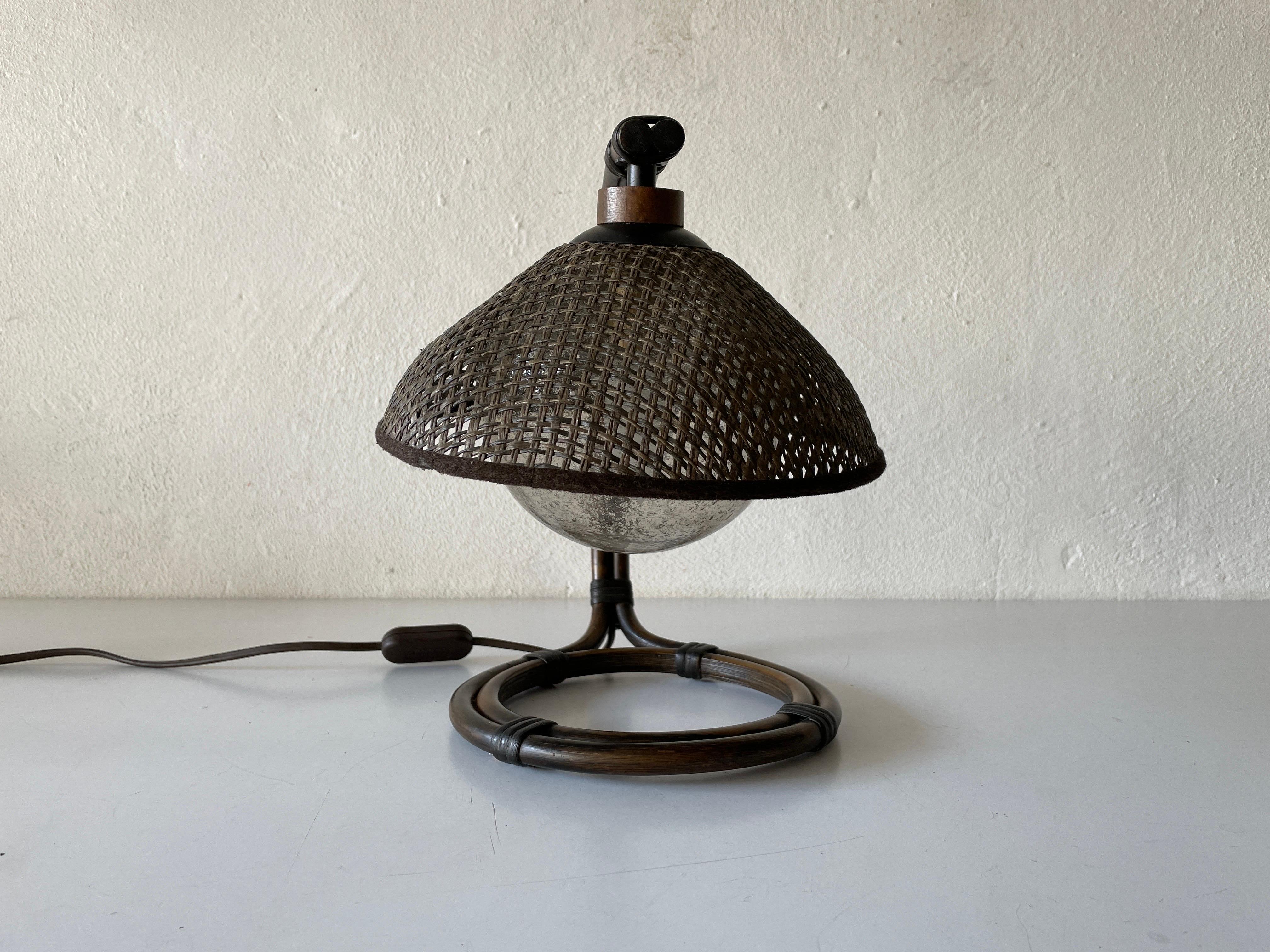 Rare Bamboo & Wicker Bedside Lamp with Air Bubble Glass by Temde, 1960s, Switzerland

Lampshade is in good condition and very clean. 
This lamp works with E27 light bulb
Wired and suitable to use with 220V and 110V for all
