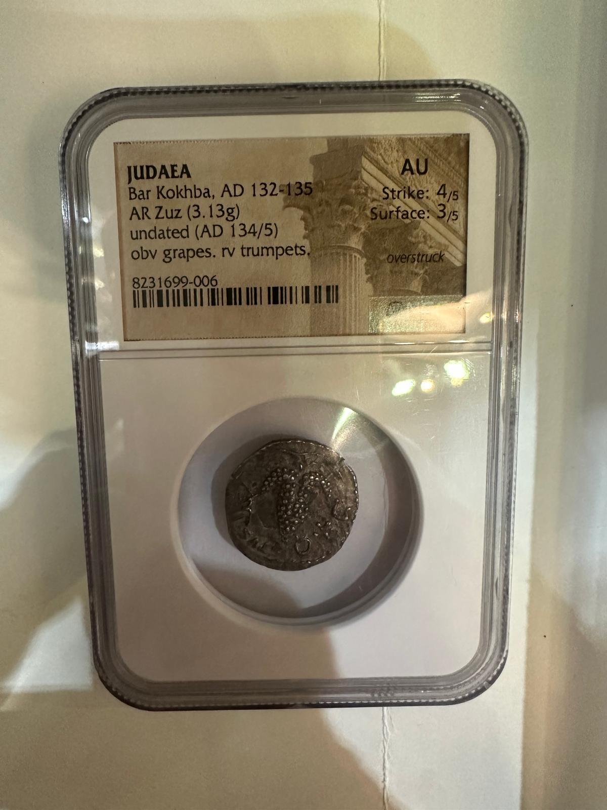 This silver AR Zuz, weighing 3.13 grams, was minted during the Bar Kokhba Revolt, a defining moment in Jewish resistance against Roman rule between 132 and 135 AD. Struck in the third year of the uprising (AD 134/135), the coin is a powerful