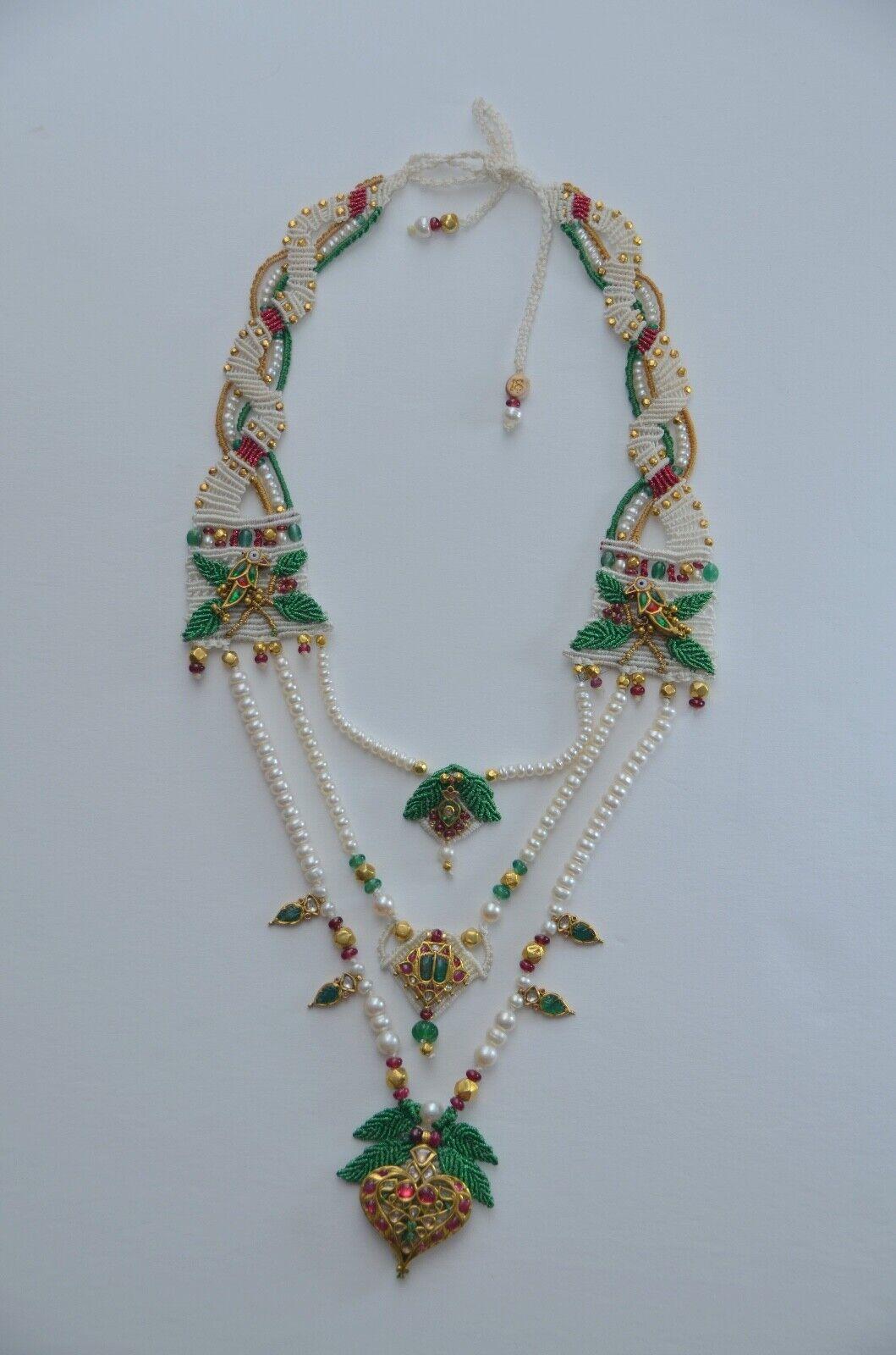 Rare Barbara Natoli Witt Rare Necklace Vintage

Very long necklace in the traditional Indian style of the Maharajas with 3  strands of pearls holding antique Kundan 24K gold ornaments set with diamonds, rubies and emeralds.
Larger size hearth charm