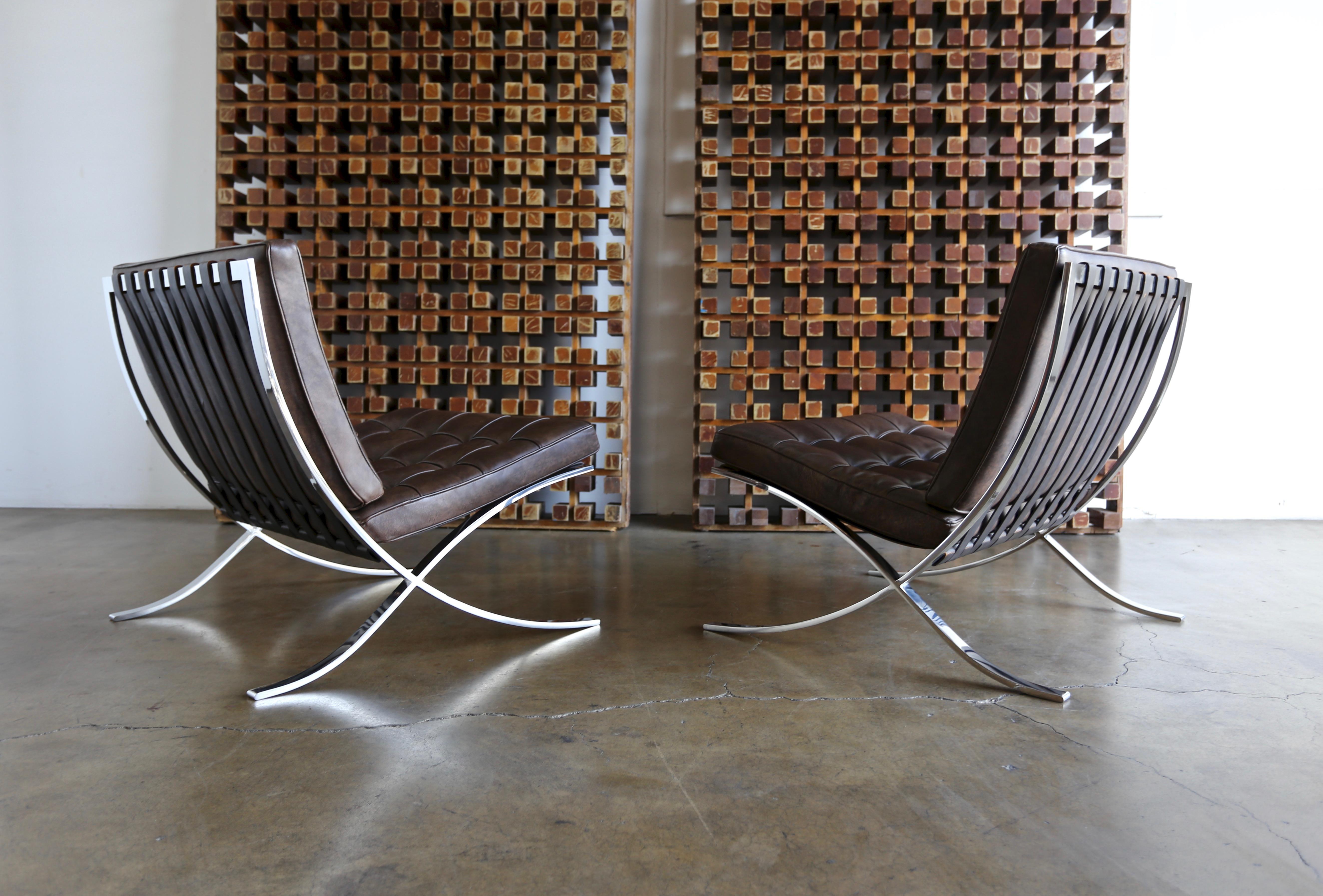 Pair of Barcelona chairs by Ludwig Mies van der Rohe for Gerald R. Griffith. Each example is hand signed. 