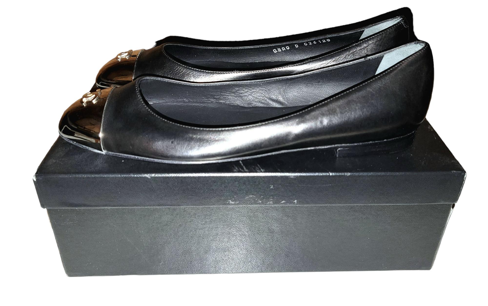Rare Authentic Chanel size 39 black leather with chrome CC accent at front of flats. The Chanel interior sole has the patent Chanel logo inside. Size 39 on the bottom of the soles. Beautiful all occasion shoes.