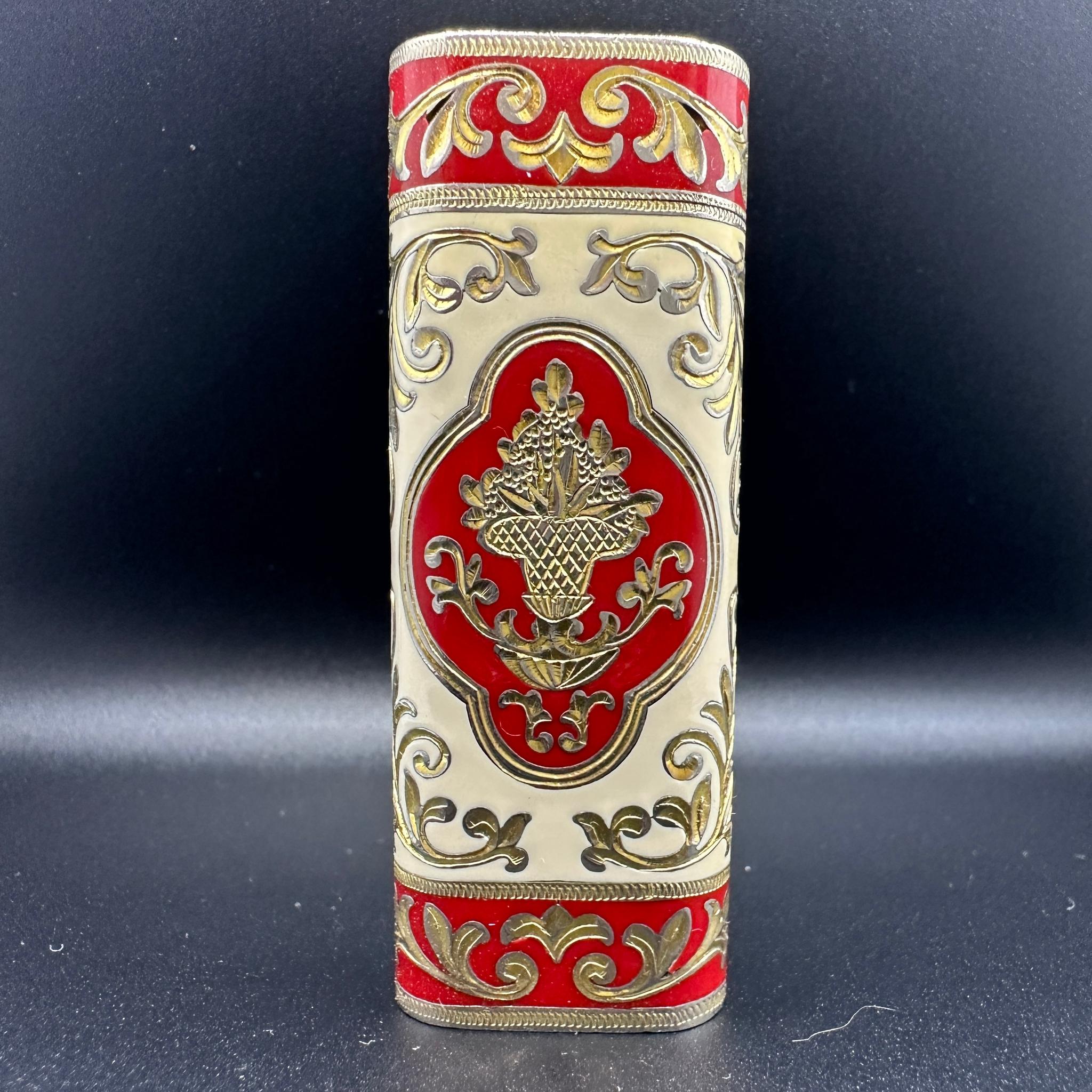 Cartier Roy king lighter.
CARTIER  Roy King Rollagas, a Unique RARE example of a ROY KING designed Cartier Rollagas lighter made circa 1970's, Gold with Red and cream shaped Baroque  lacquer, mint condition.
Roy King emblem on top side part of