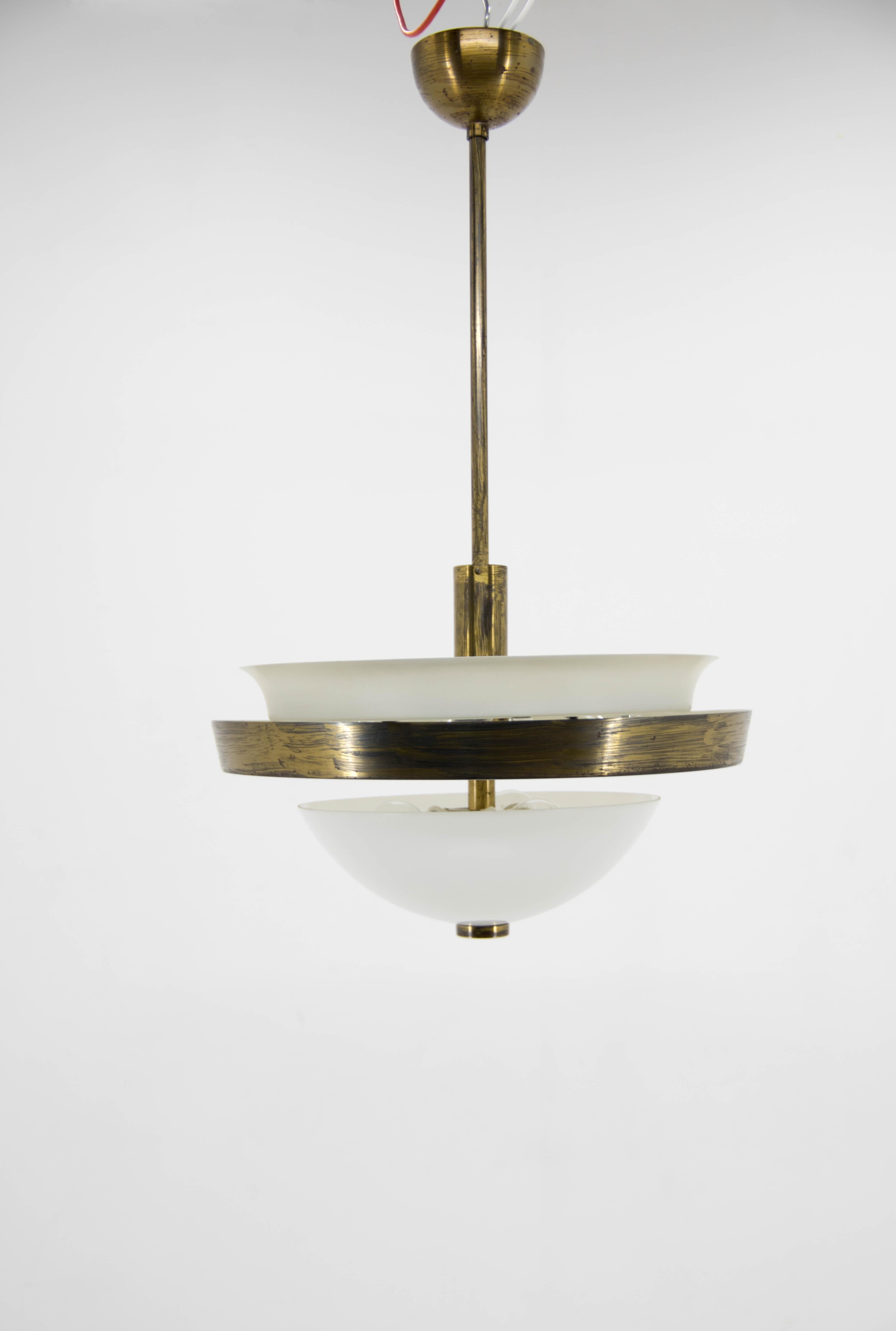 Very rare 7-flamming Bauhaus chandelier made in Czechoslovakia by IAS in 1930s. Perfect original condition. Lacquered brass shows the traces of painted brush. Original white paint in perfect condition. Opaline glass shade. Rewired: two separate