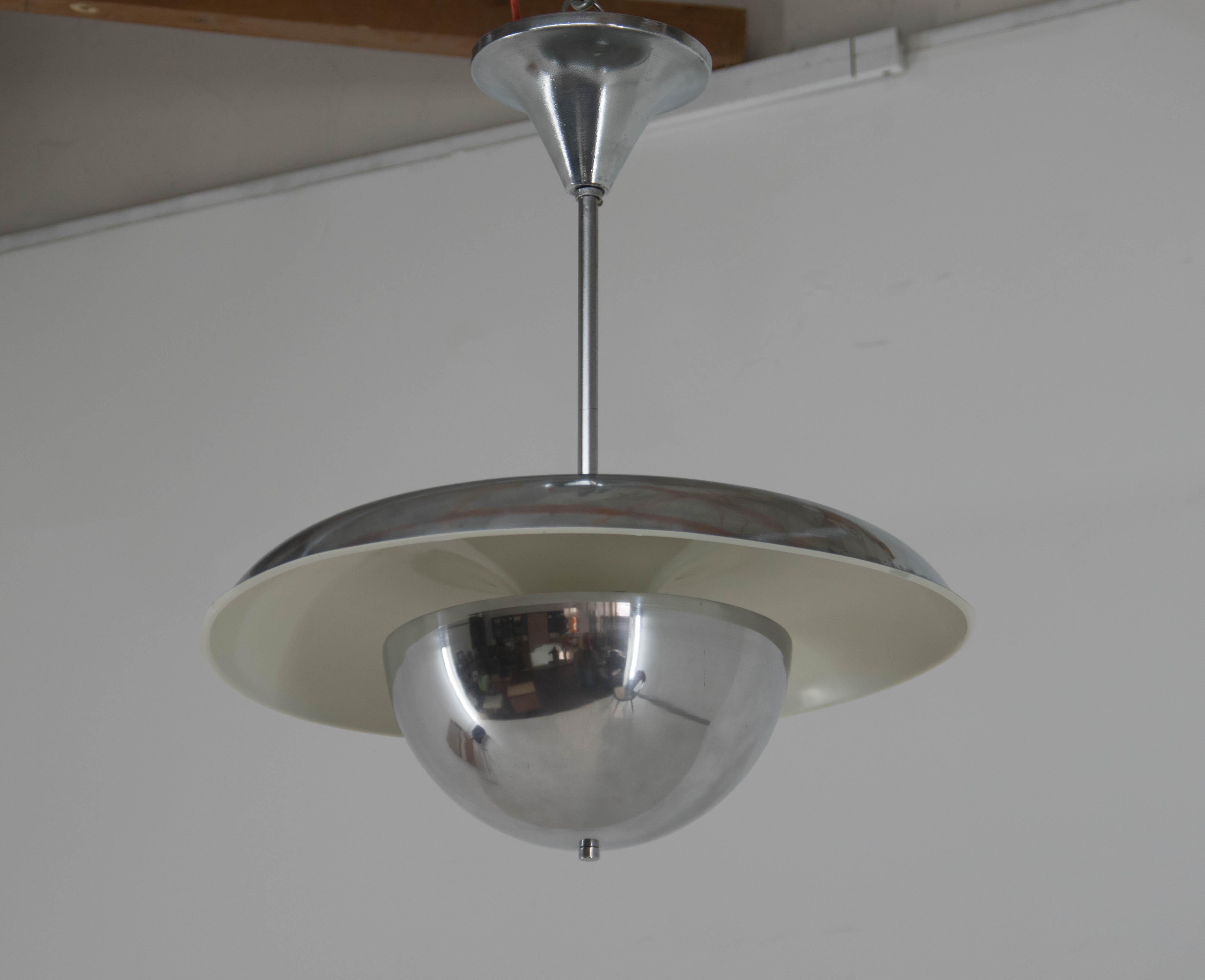 Very early UFO chandelier designed by Anyz and executed by IAS in 1930s.
Chandelier was restored: two cracks on the edge have been repaired and are not visible from below. 
Item was cleaned, polished and rewired. New ivory paint.
Two separate