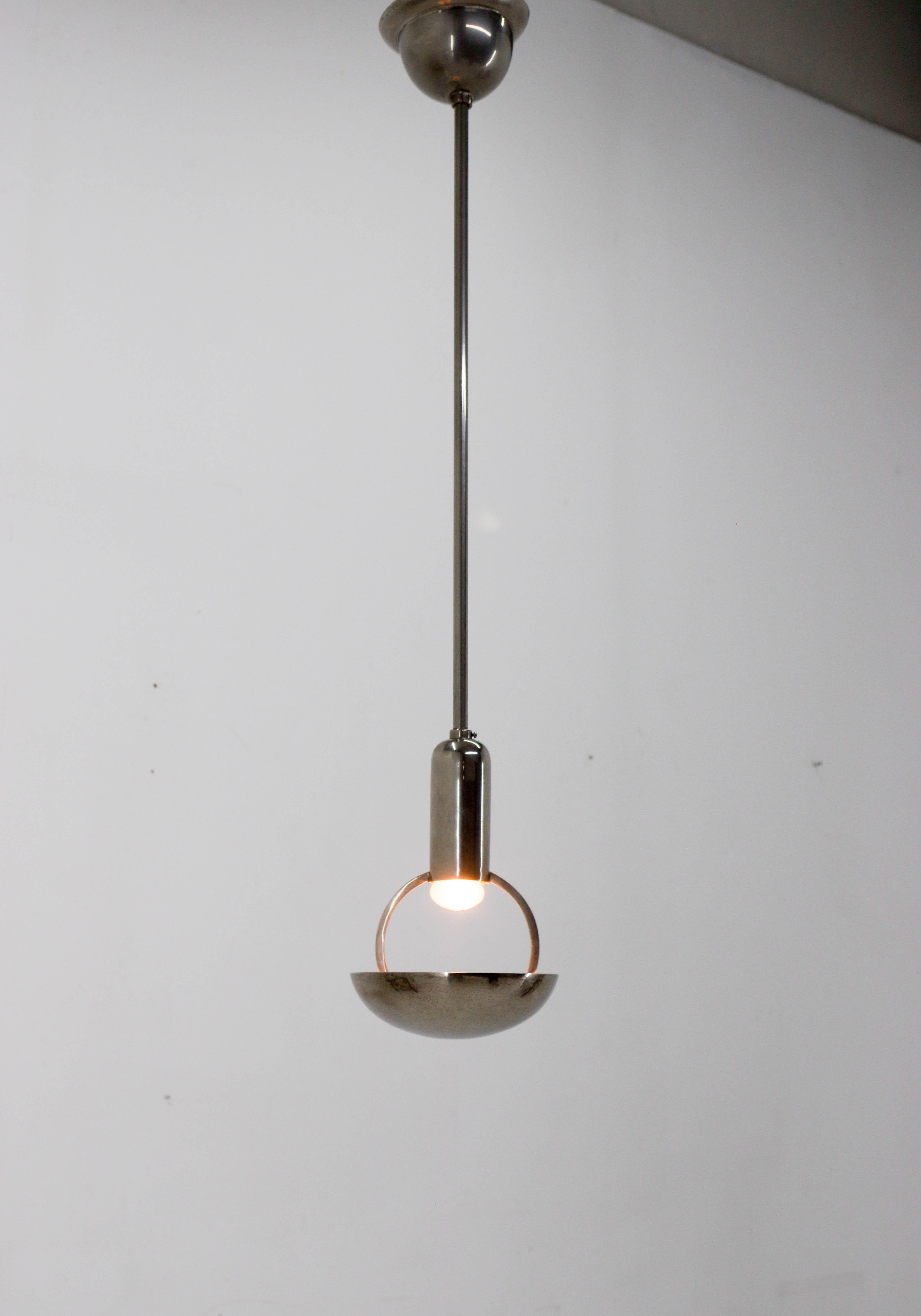 Rare Bauhaus pendant made in 1930s.
Minimalistic design.
Nickel-plating with minor age patina - polished
Central rod can be shorten on request.
Rewired: 1x60W, E24-E26 bulb
US wiring compatible