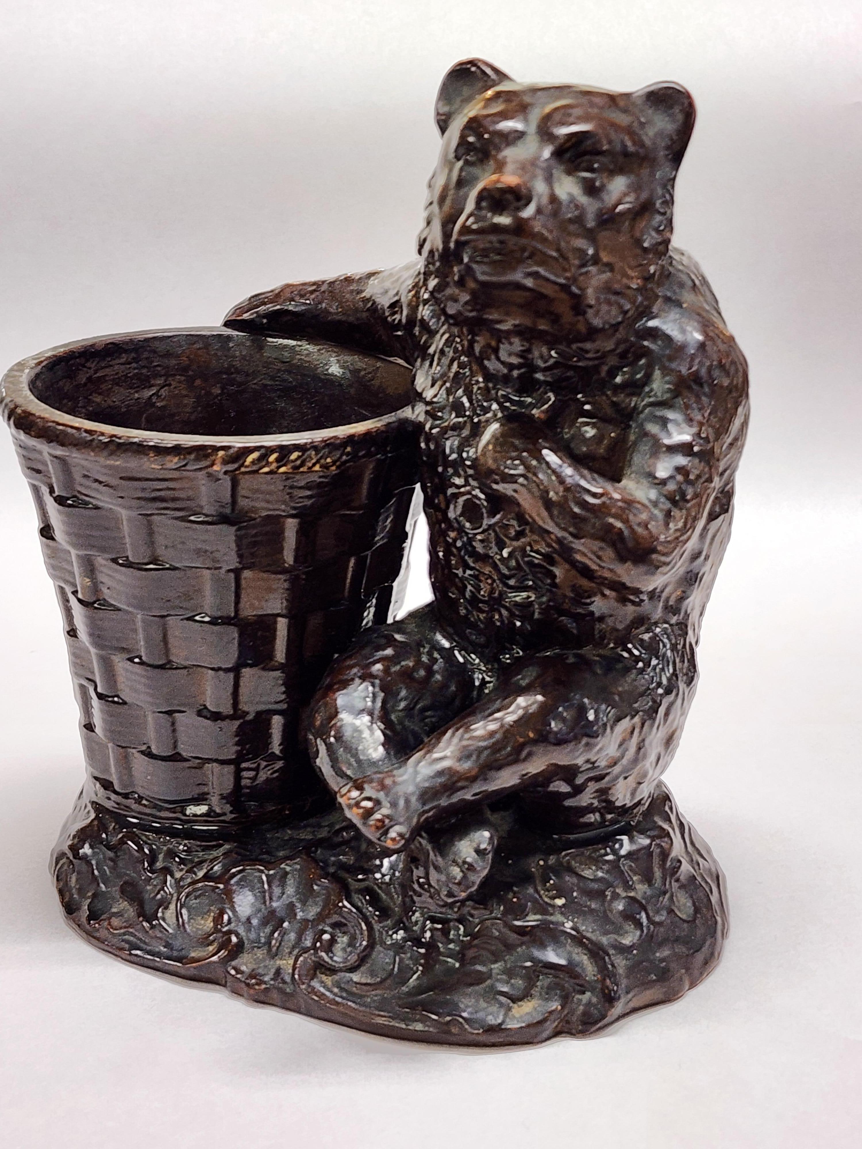 Rare victorian terracotta and pipe clay cigar holder, late nineteenth century. Produced by the J&C China company of Bavaria. 
Made for holding cigars. This playful bear with a growl on his face and pipe in his hand hearkens you forward to take a