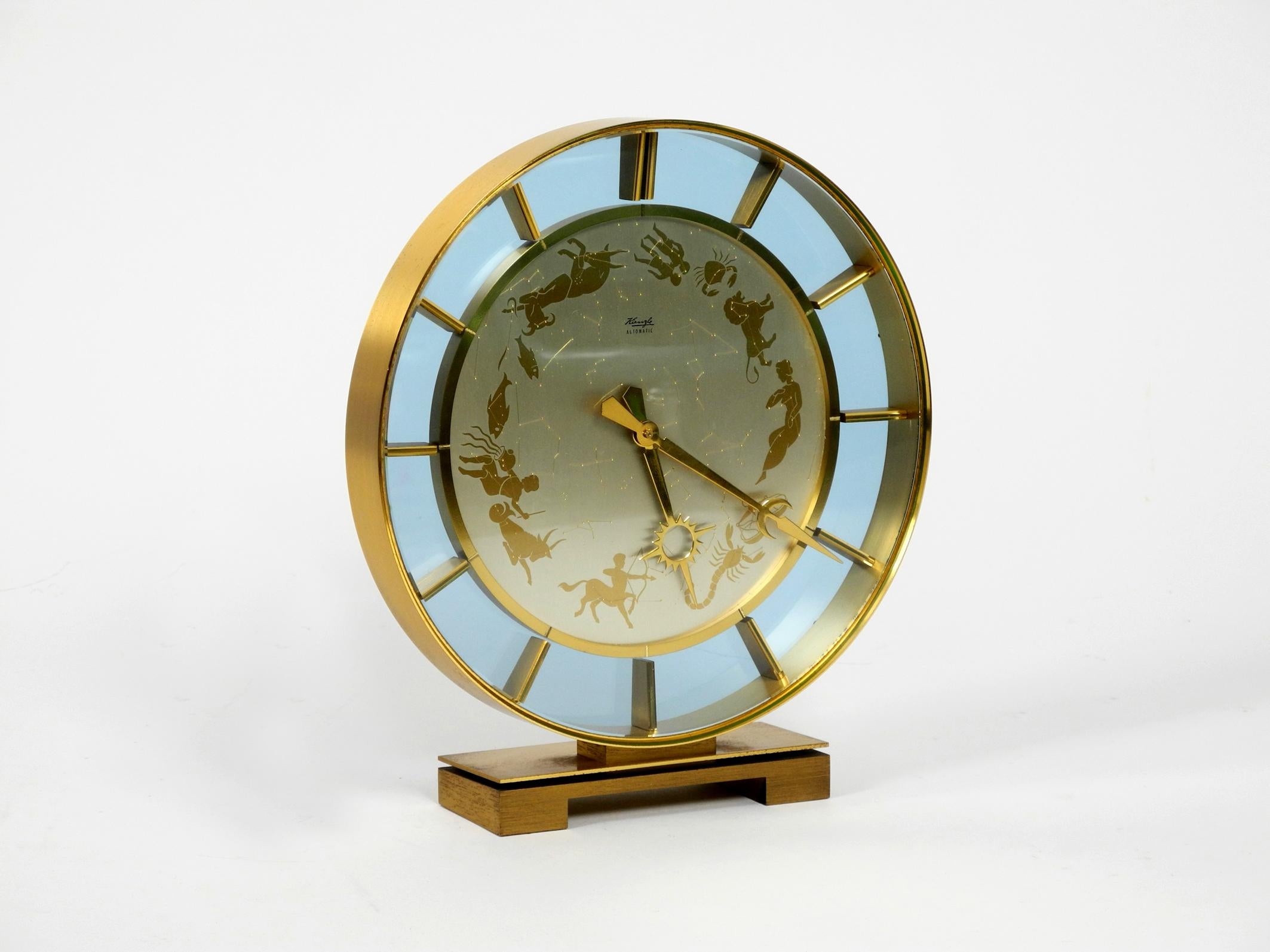 Rare beautiful 1970s big Kienzle Zodiac table clock made of heavy brass.
Great elegant very high quality design with many details.
All made of brass, front with a glass pane, back made of plastic.
Battery powered. 100% original condition. Fully