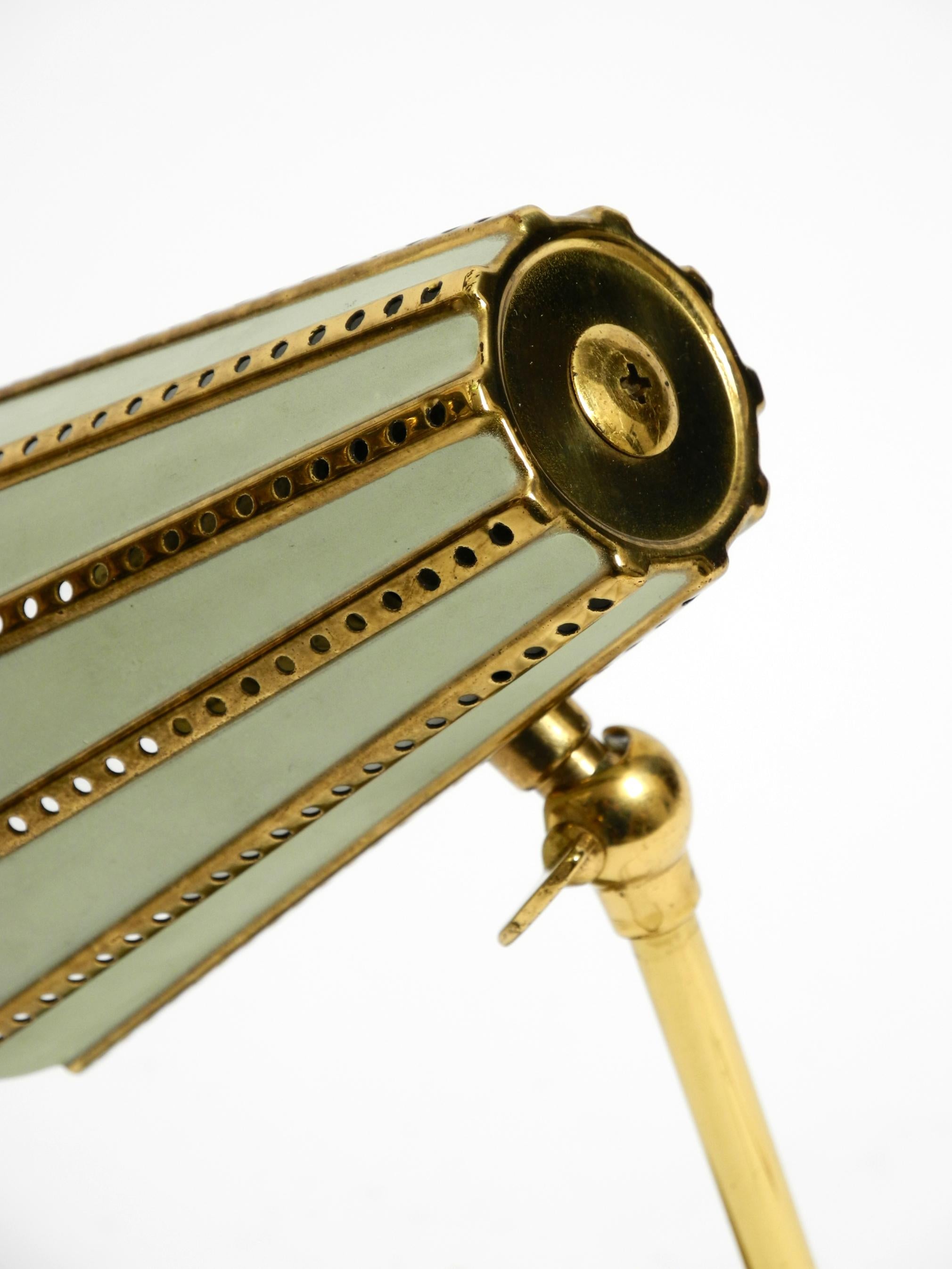 Rare beautiful mid-century brass night table lamp with a perforated metal shade For Sale 4
