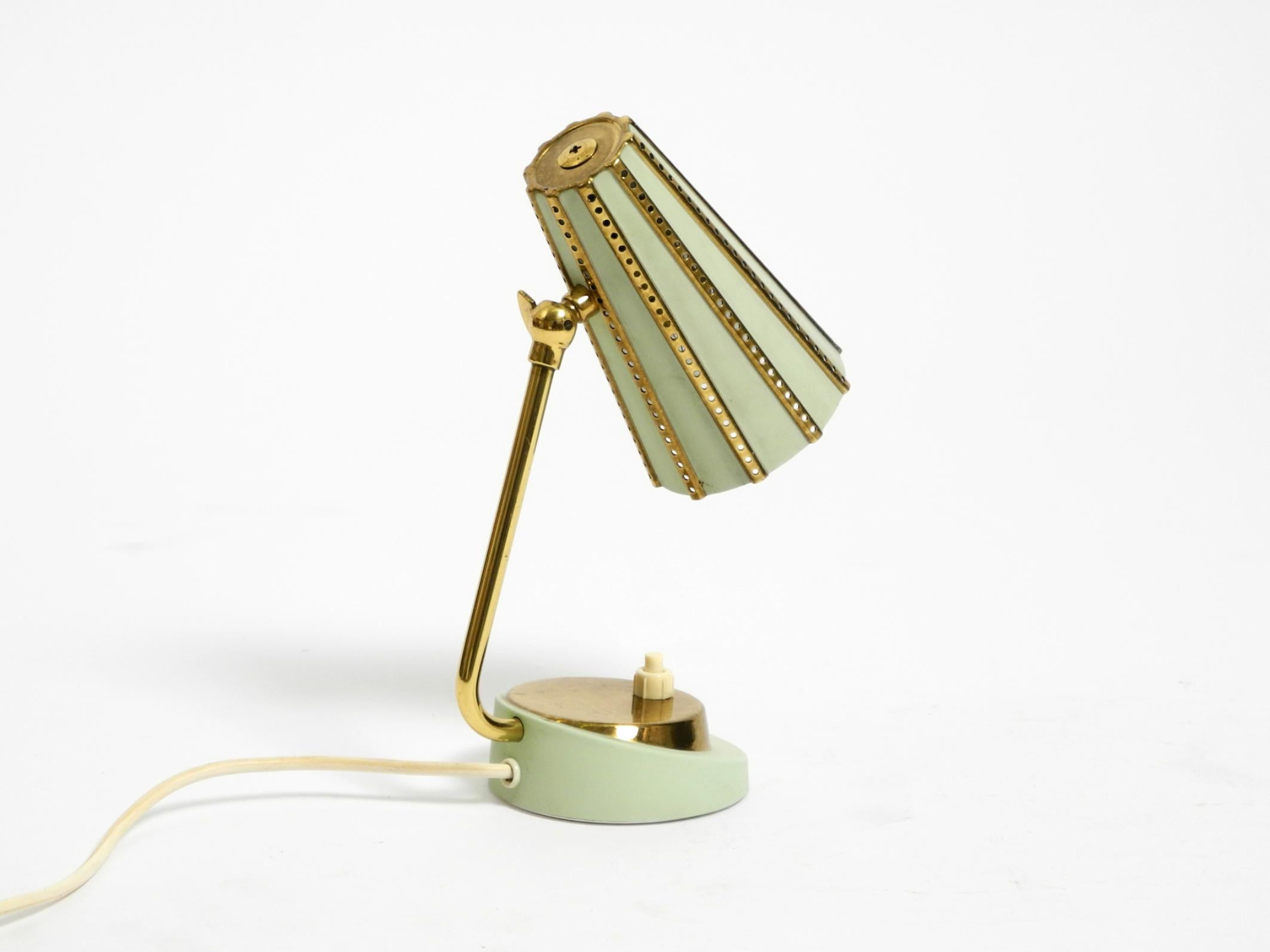 Mid-Century Modern Rare beautiful mid-century brass night table lamp with a perforated metal shade For Sale