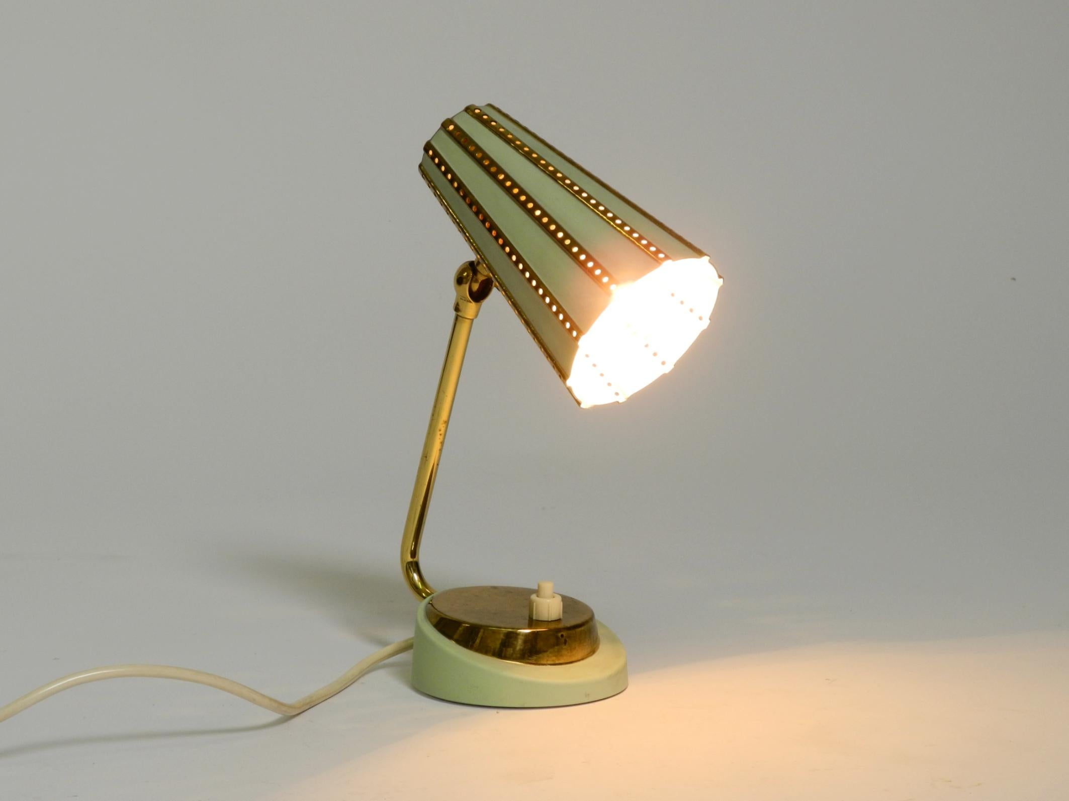 Mid-20th Century Rare beautiful mid-century brass night table lamp with a perforated metal shade For Sale