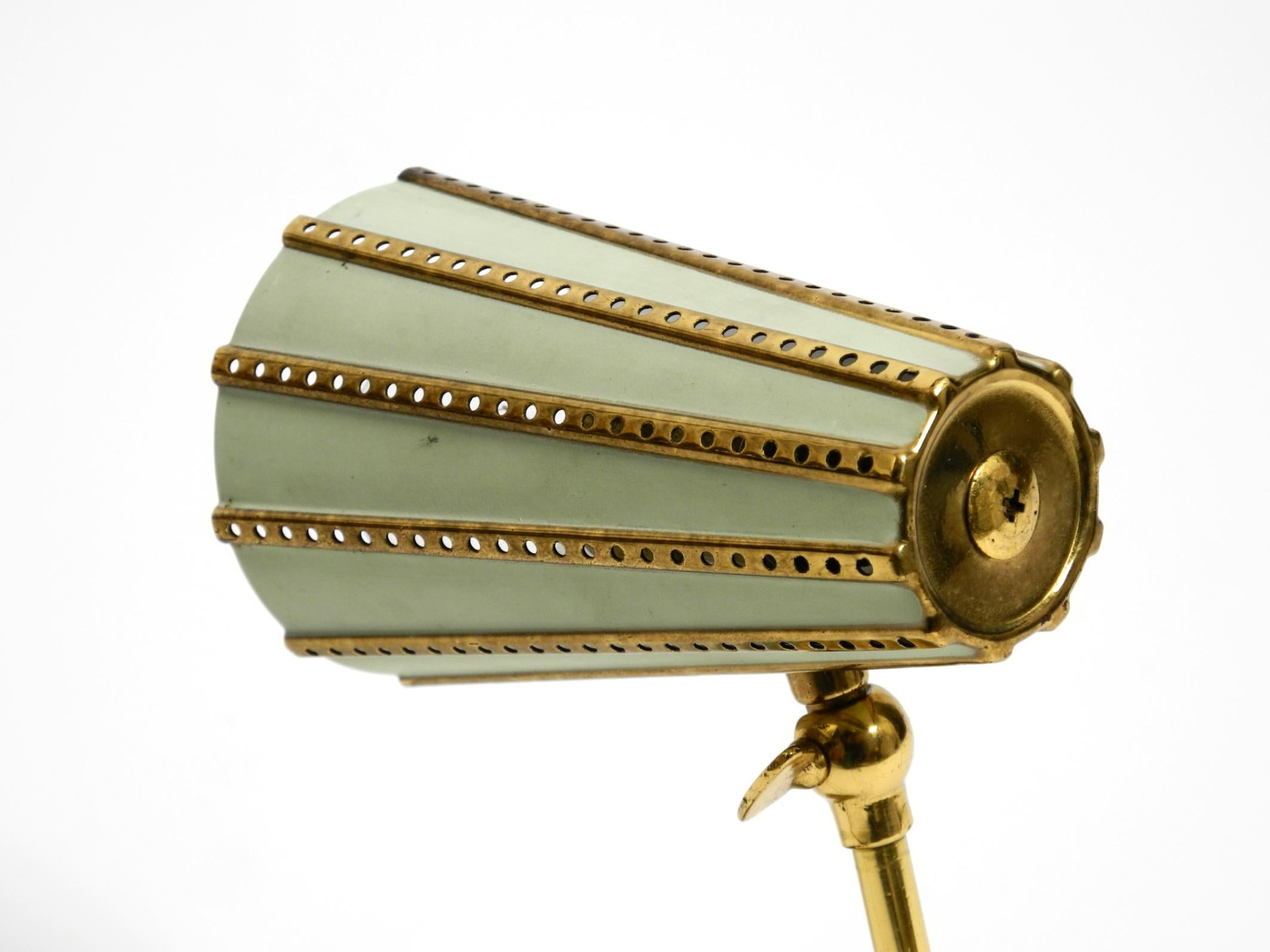 Metal Rare beautiful mid-century brass night table lamp with a perforated metal shade For Sale