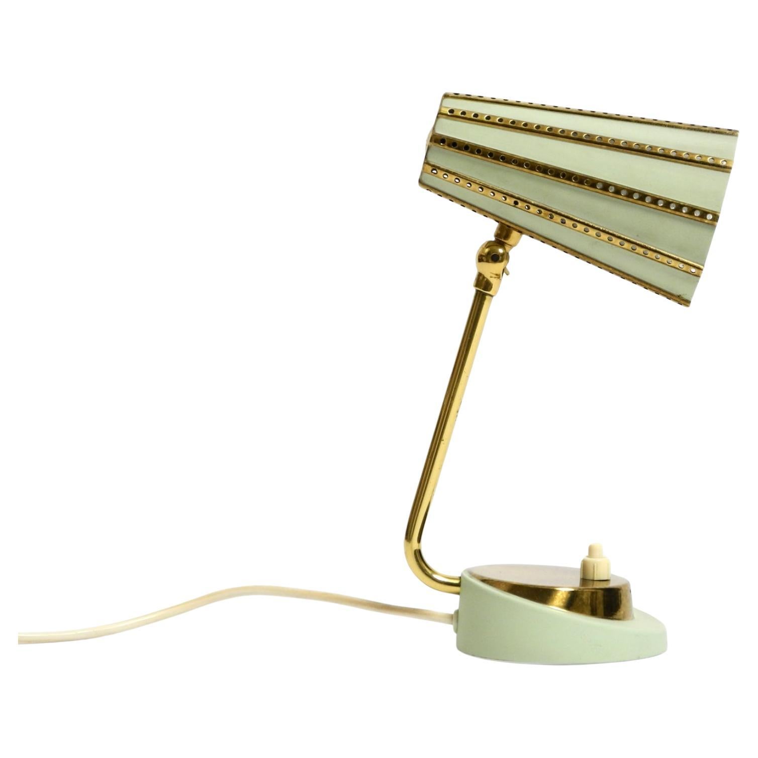 Rare beautiful mid-century brass night table lamp with a perforated metal shade For Sale