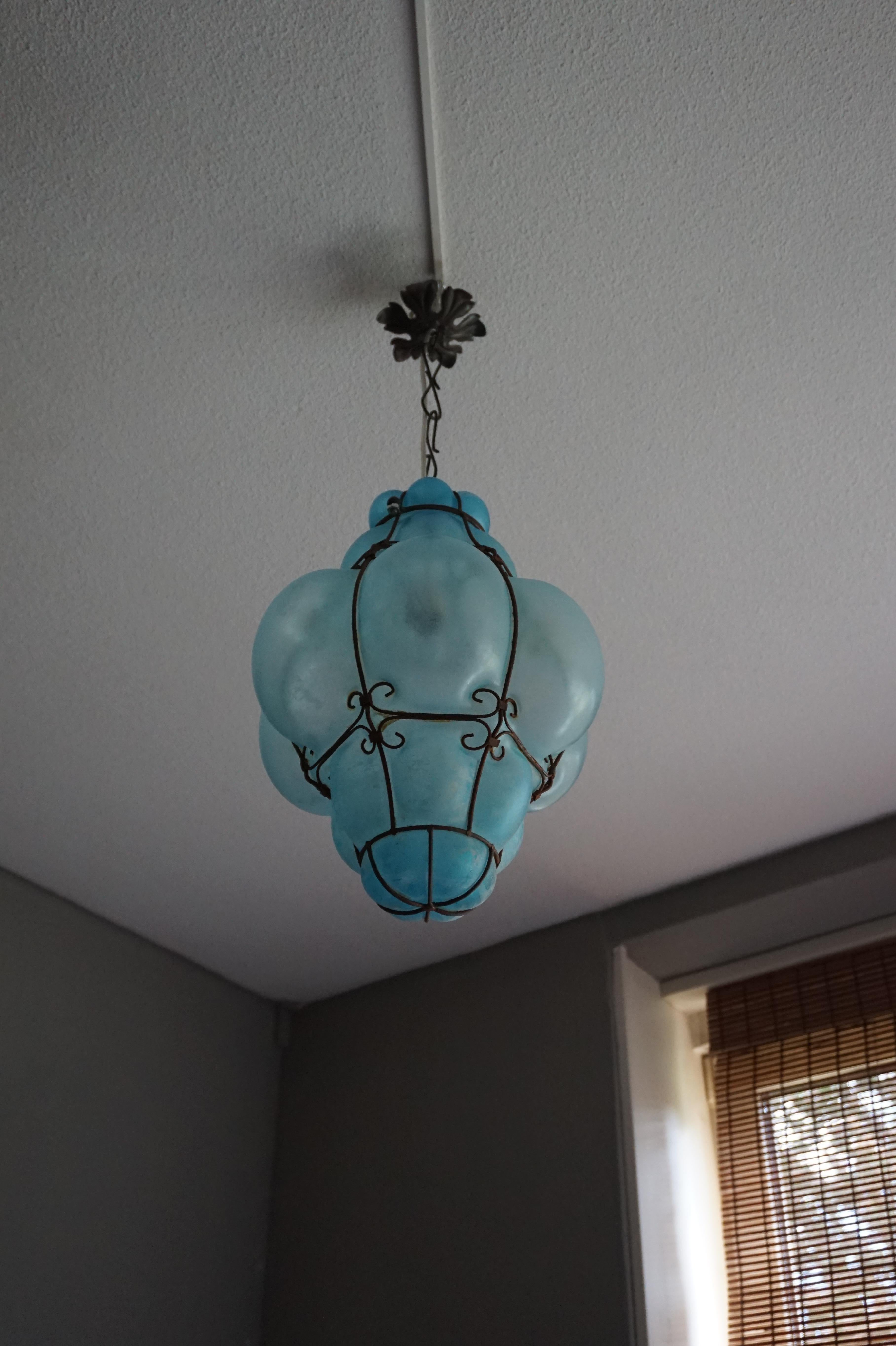 Rare and highly decorative color Venetian light fixture.

This 'ocean view' glass art pendant is another one of our recent great finds. Handcrafted and mouthblown in one of the Venetian glass art studios in the 1950s or 1960s this rare color,