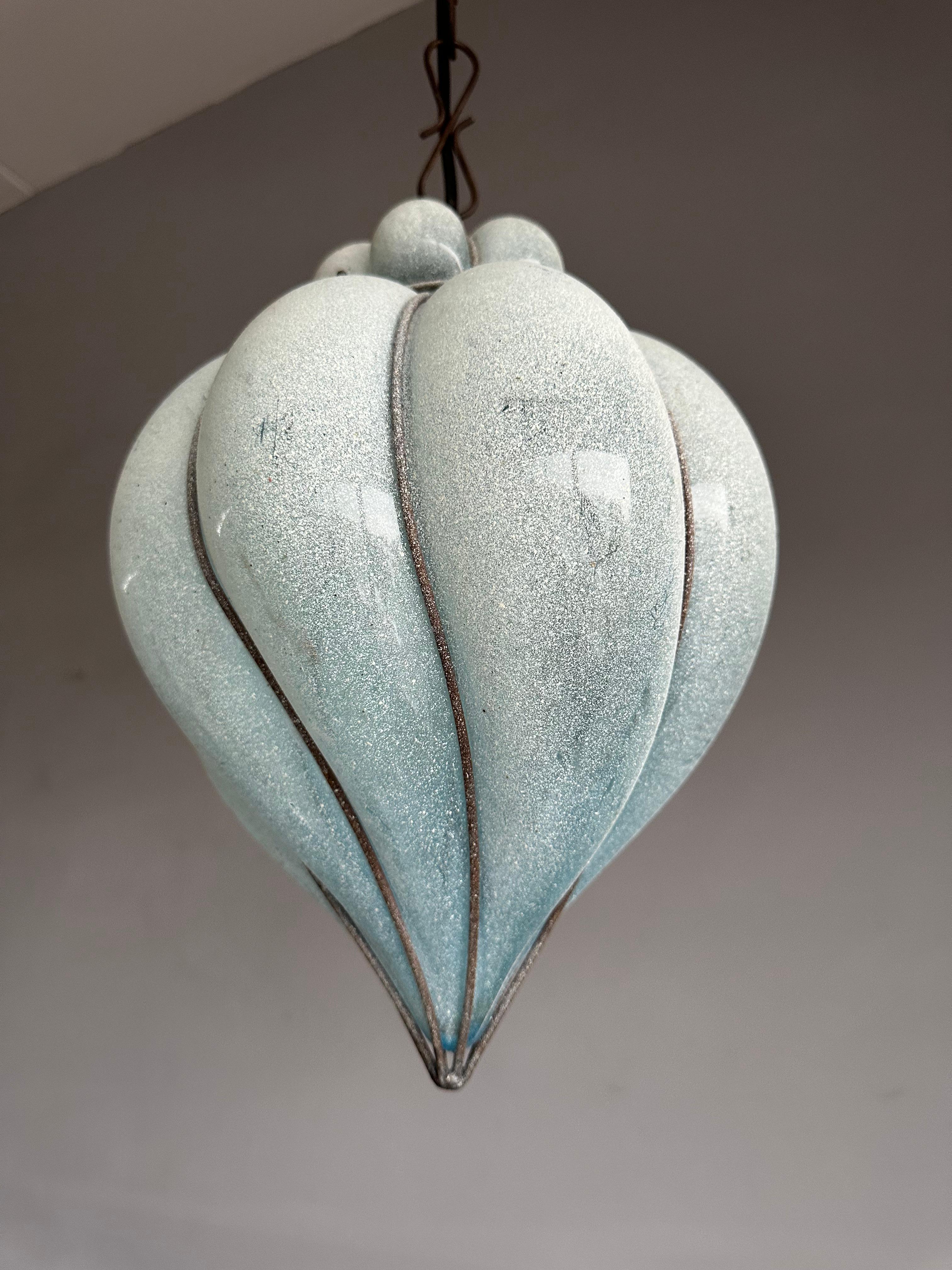 Rare twirled design and highly decorative color Venetian light fixture.

This work of art glass pendant is another one of our recent great finds. Handcrafted and mouthblown in one of the Venetian glass art studios in the 1970s, 1980s this rare blue