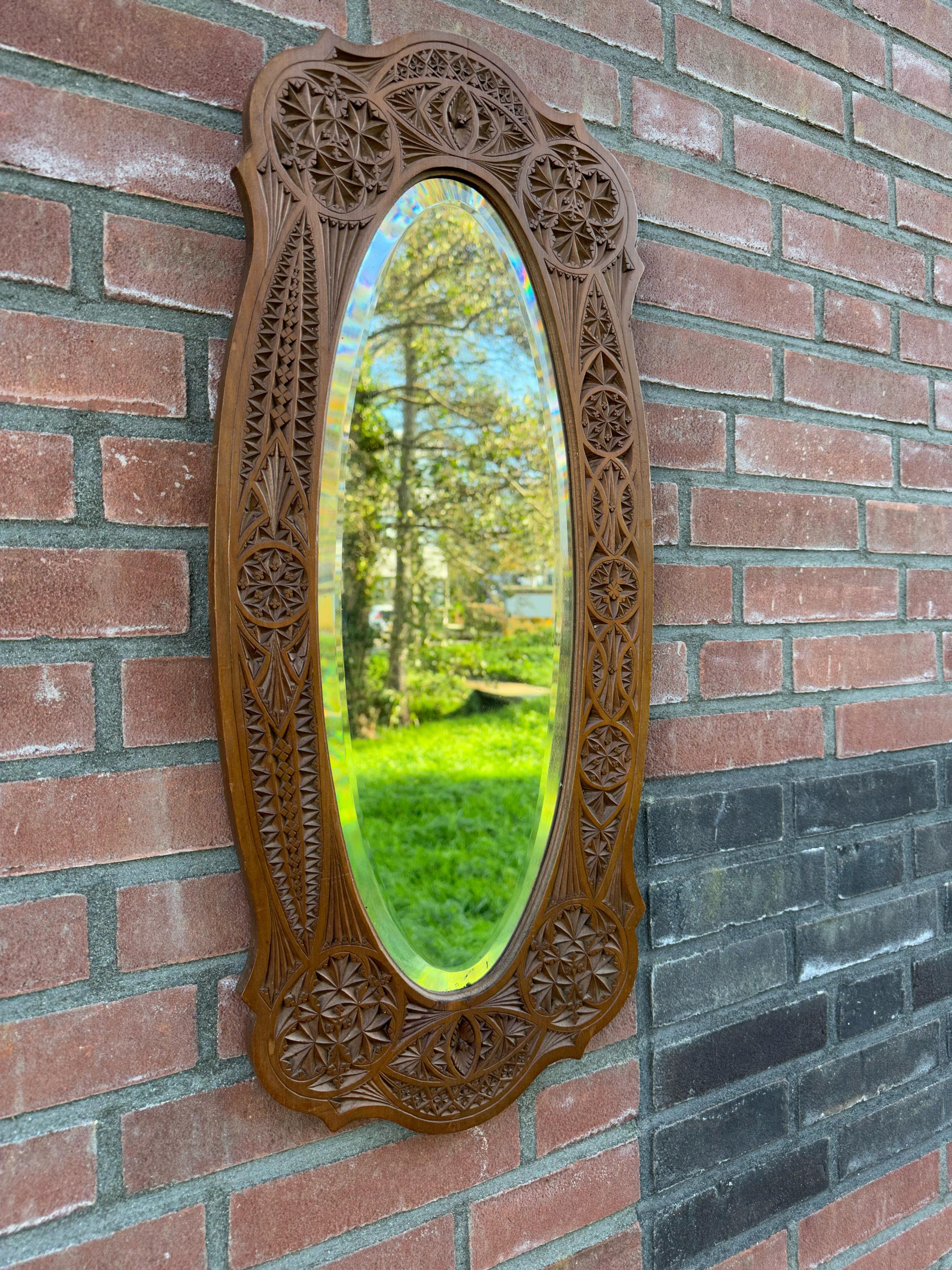 Striking wall mirror with handcarved geometrical 'flowers' and trefoil symbols.

Via one of our foreign contacts we recently purchased this perfectly fine and deeply handcarved, sculptural wall mirror. This perfectly handcarved wooden frame has
