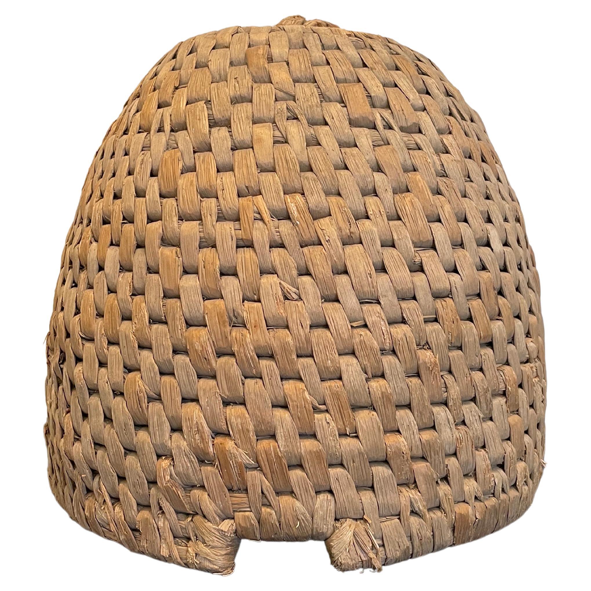 A bee skep is a traditional round hive made of straw or dried grass. Multiple strands of straw are bundled together to form a thick rope and the rope is then coiled and bound together to make the skep.

The word skep is thought to have come from