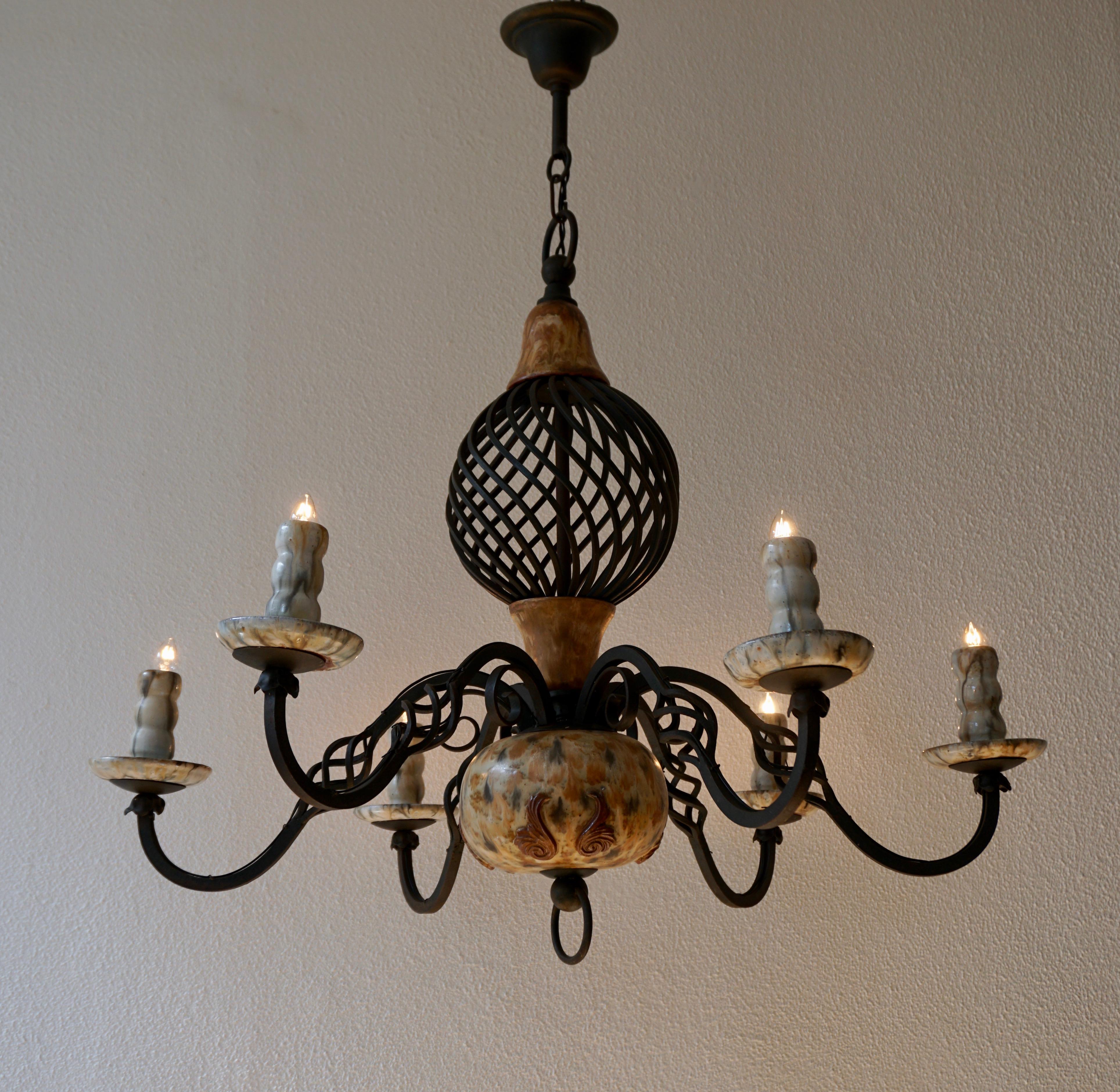 Rare ceramic and wrought iron chandelier by Antoine Dubois,Belgium.
Diameter 90 cm - height fixture 76 cm - total height 96 cm - weight 10 kg.

13 generations of this family have been around since the 1960s
actively engaged in: turning, pouring,