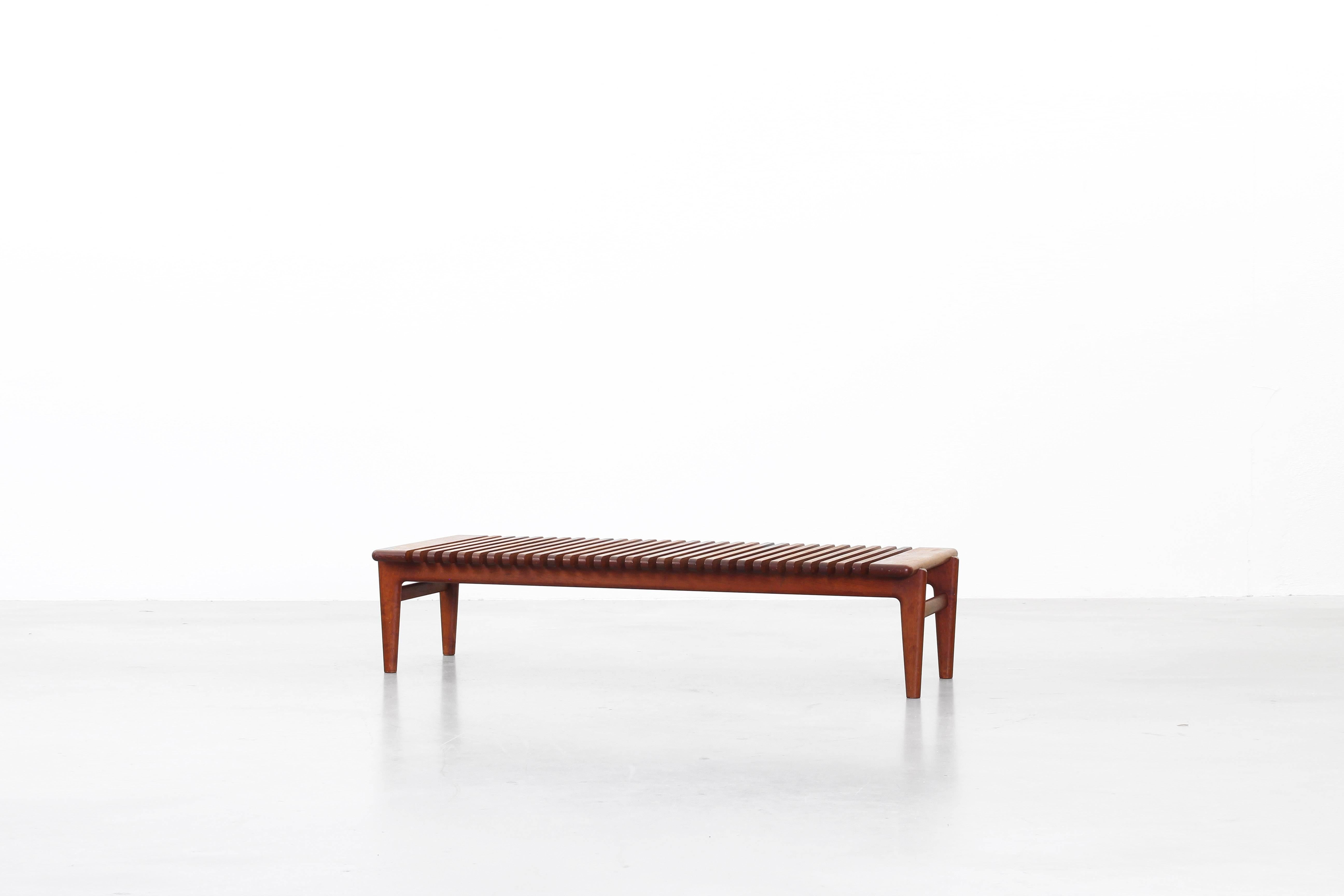 Very rare bench designed by Hans J. Wegner and produced by Johannes Hansen, Denmark 1953. The bench is in an excellent condition with great patinated teakwood.
Marked with the old logo 