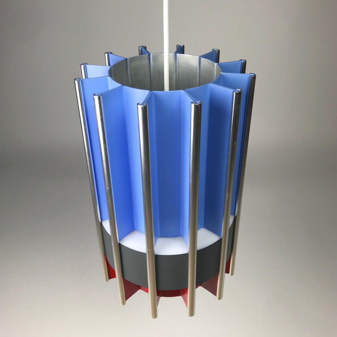 The rare Pantre by Bent Karlby for Lyfa mid 1960s Denmark. 

Sections of blue and red lacquered parts divided with a grey belt of lighting shining through the sides. Light is also distributed up and down wards. 

All the pieces are put together