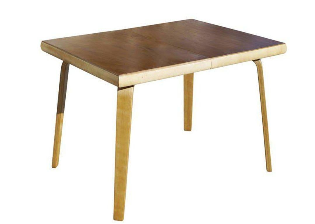 A rare steam formed bent plywood dining table designed by Herbert Von Thaden and Donald Lewis Jordan for their company Thaden-Jordan Furniture. This table is the rare early square shaped table which was produced in limited numbers. 

This table is