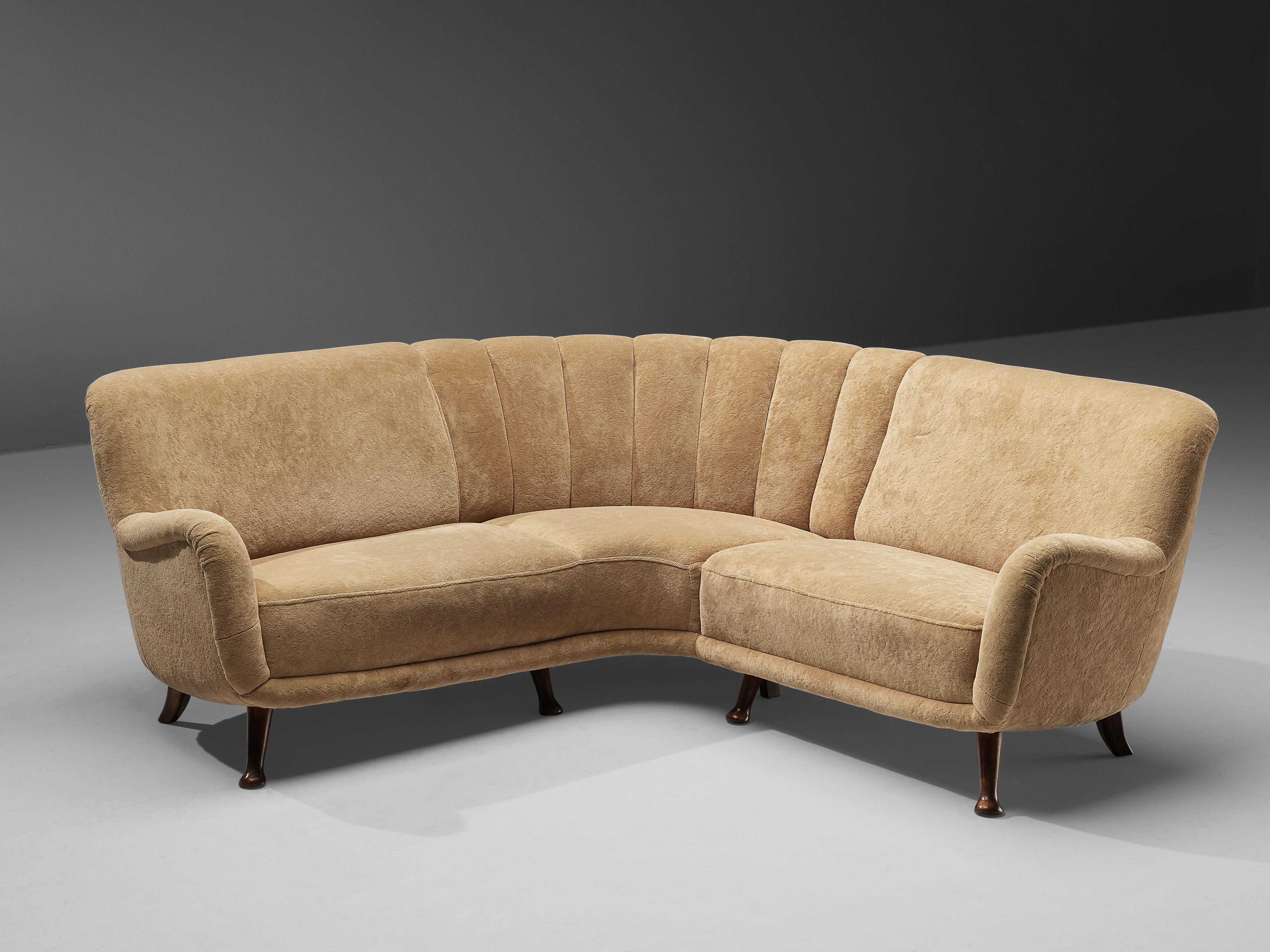 Berga Mobler, sofa, stained beech, teddy upholstery, Denmark, 1940s.

This bold and rounded corner sofa by Berga Mobler is very comfortable. The whole shell is slightly tilted backwards. The sofa rests on eight small beech legs that bend outwards