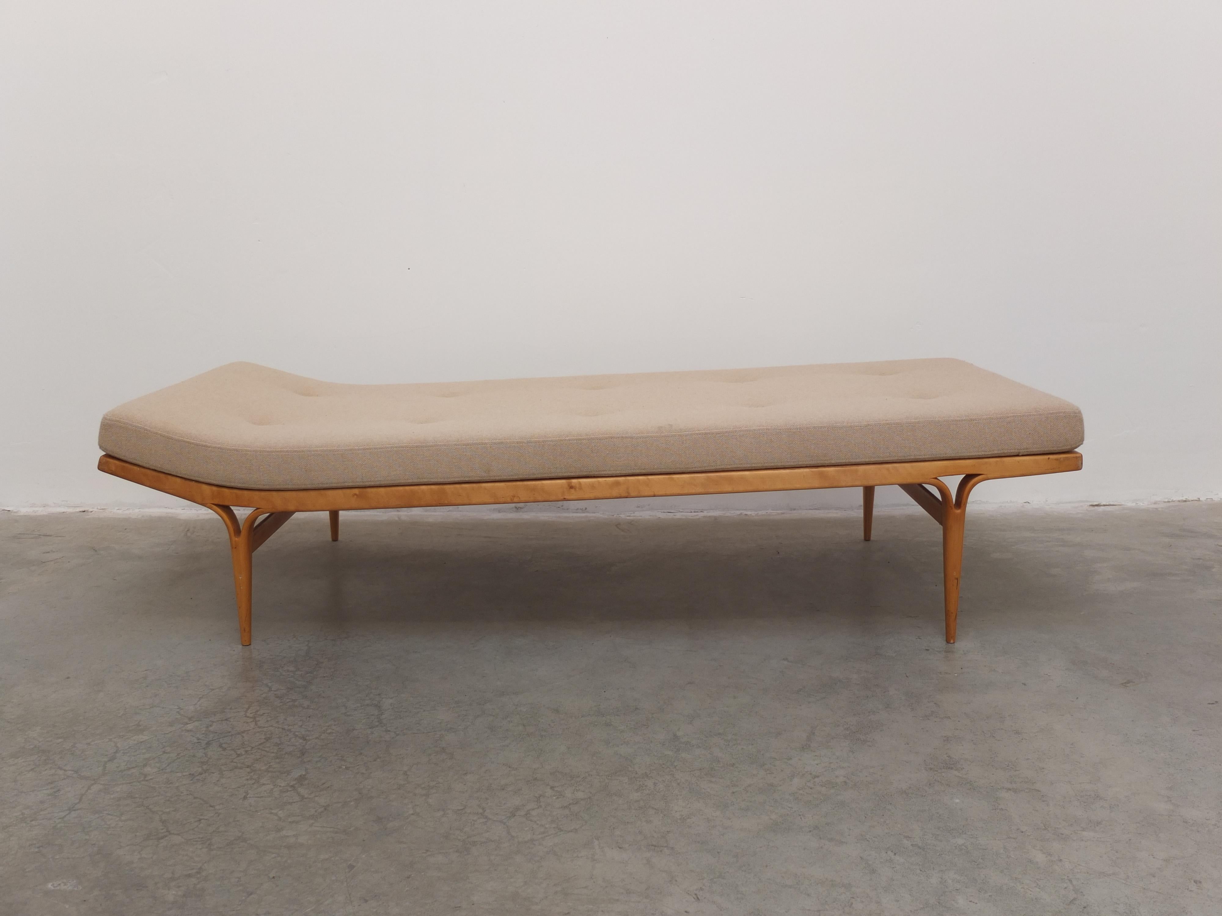 A rare and beautiful ‘Berlin’ daybed designed by Bruno Mathsson for Karl Mathsson in 1957. It was first shown in 1957 at the International Building Exhibition in Berlin where it received its name. The elegant frame is made of beech wood and the thin
