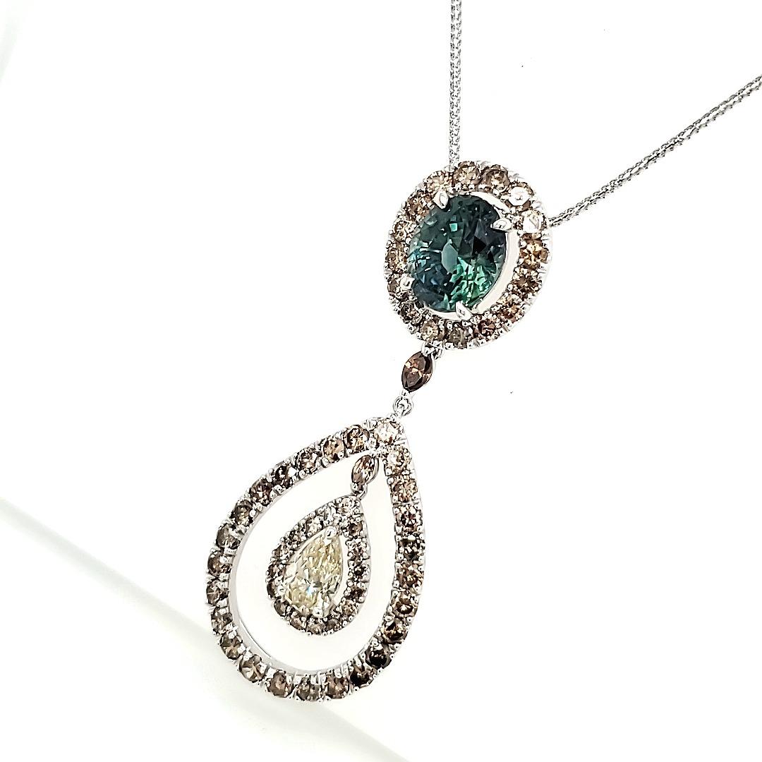 Contemporary Rare Bi-colored Blue-Green Sapphire pendant with diamonds For Sale