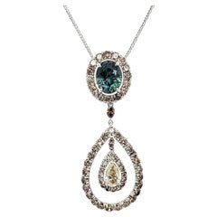 Rare Bi-colored Blue-Green Sapphire pendant with diamonds