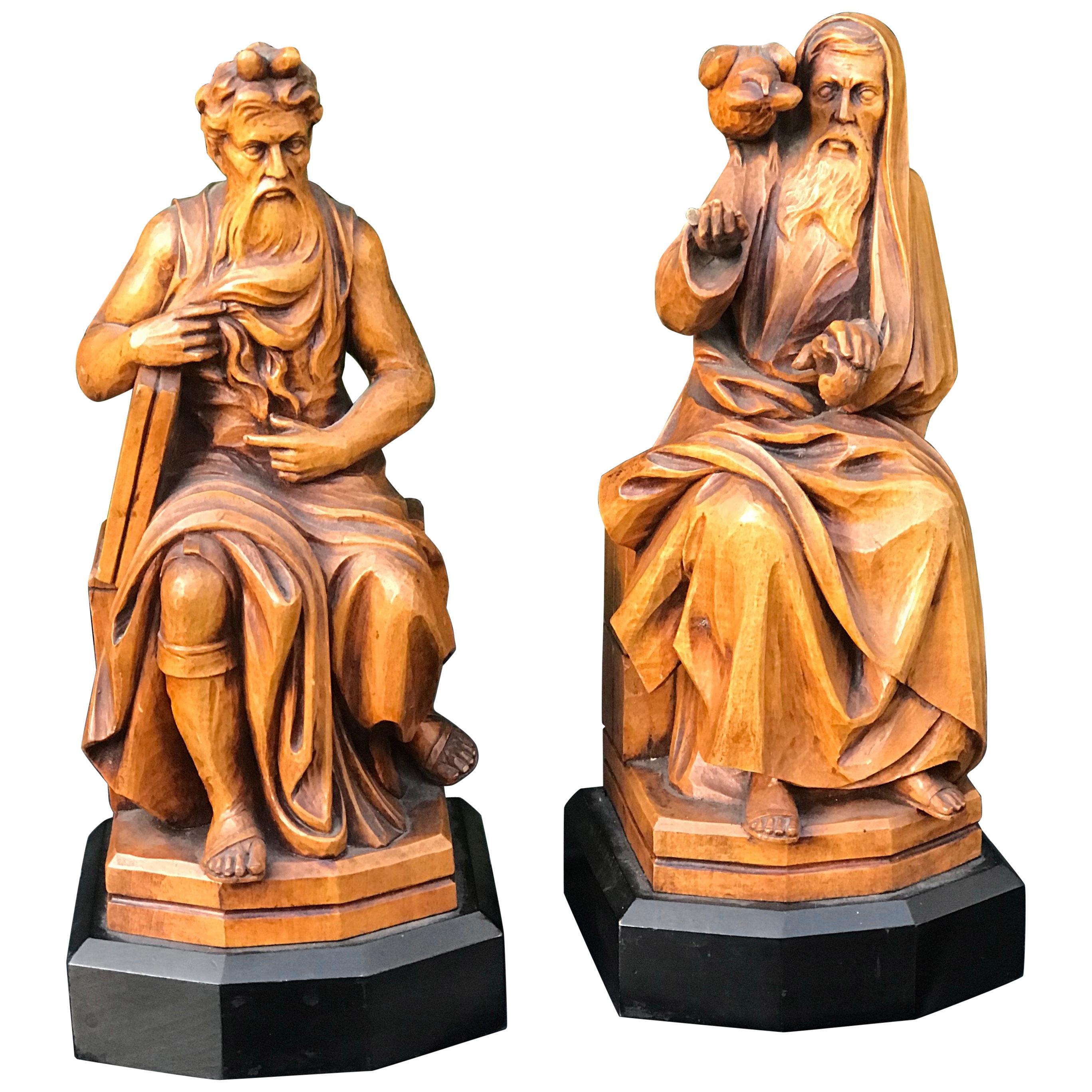 Striking and sizable pair of late 1800s, Italian grand tour bookends.

This incredibly well crafted pair of sculptural bookends depicts Moses holding the Tablets of stone and the other, sitting figure who is feeding the raven/crow on his shoulder is