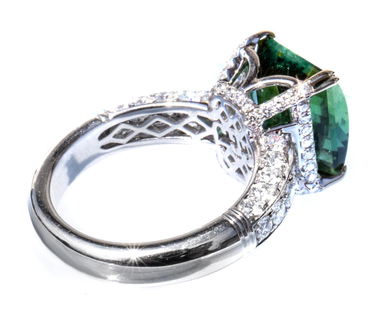 This is one of our newest rings. It's rare too!  Did you know tourmalines come in over 16,000 colors. This is a bicolor indicolite (bluish) tourmaline. One half is bluish green (slightly greener); the other half is greenish blue (slightly bluer).