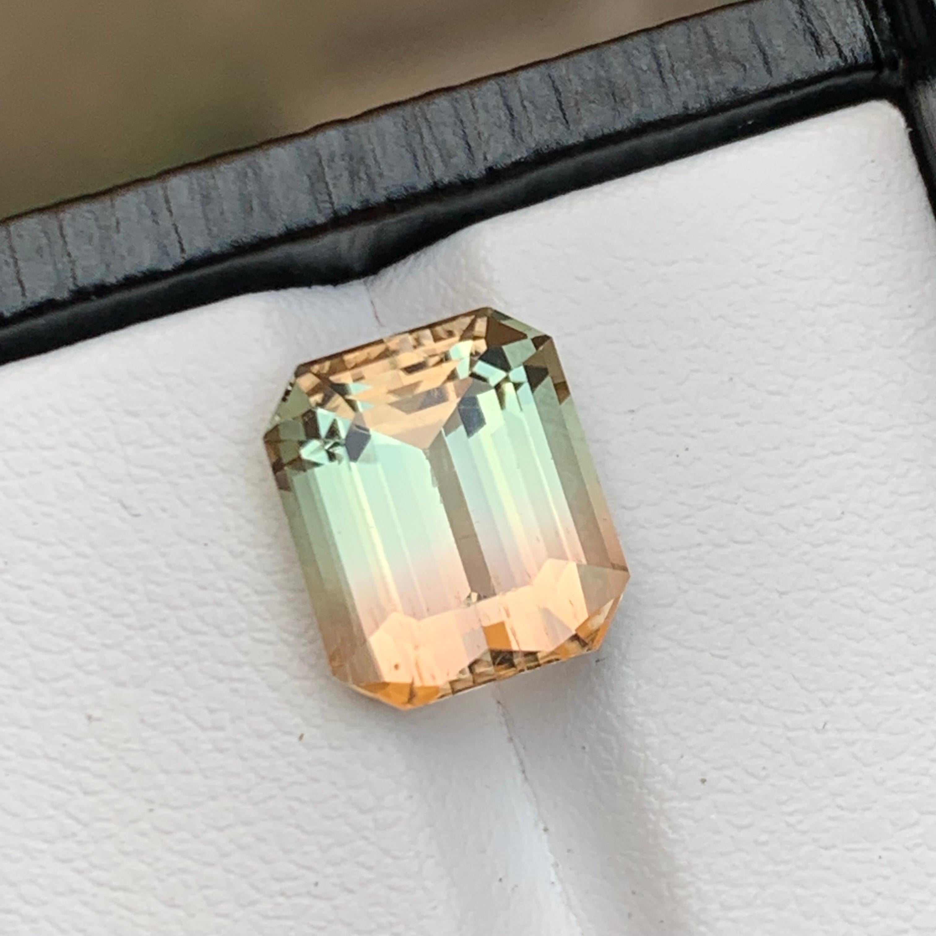 Introducing our stunning 5.80 Carat Bicolor Natural Tourmaline Loose Gemstone, sourced from Africa and meticulously crafted in an elegant emerald cut. Revel in its exceptional luster and eye-clean clarity, making it the ideal choice for both refined