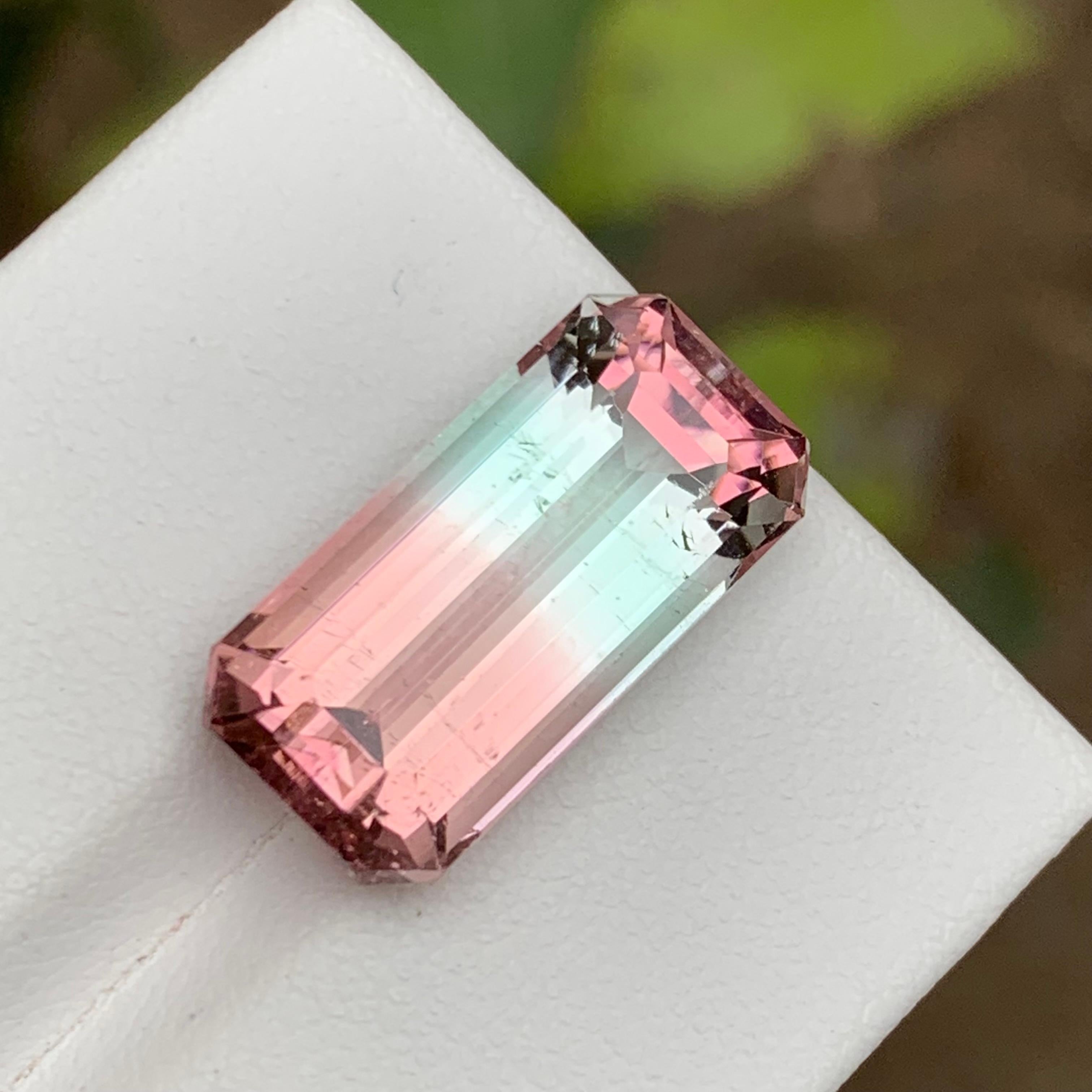 GEMSTONE TYPE: Tourmaline
PIECE(S): 1
WEIGHT: 12.65 Carat
SHAPE: Step Emerald Cut
SIZE (MM): 19.36 x 9.56 x 7.85
COLOR: Bicolor
CLARITY: Slightly Included 
TREATMENT: None
ORIGIN: Afghanistan
CERTIFICATE: On demand

Introducing a breathtaking marvel