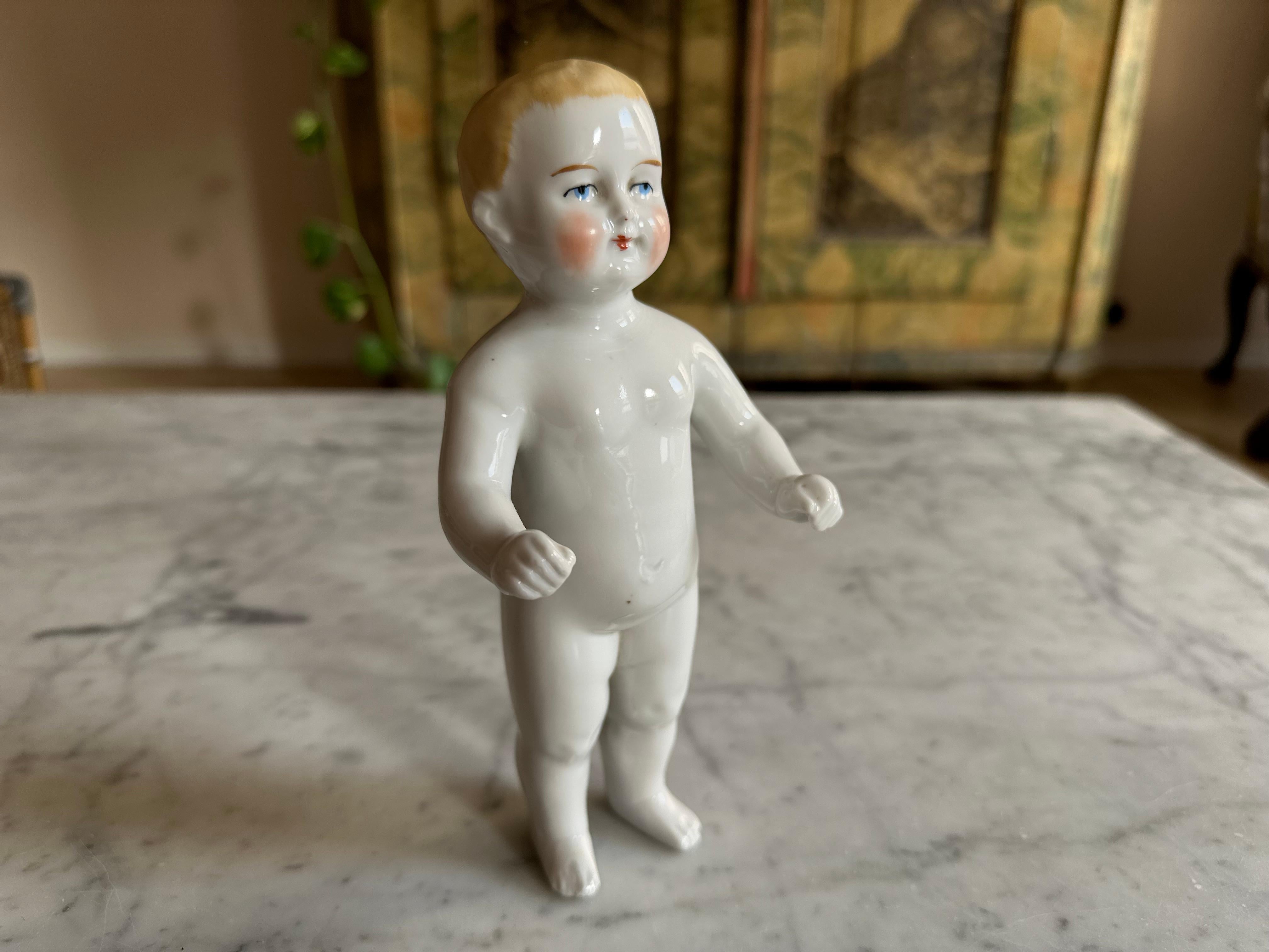 This exquisite Biedermeier porcelain bathing doll, dating back to around 1820, is a fascinating piece of early toy history. During the 19th century, these dolls were used as floating bath toys for children, despite their delicate and fragile