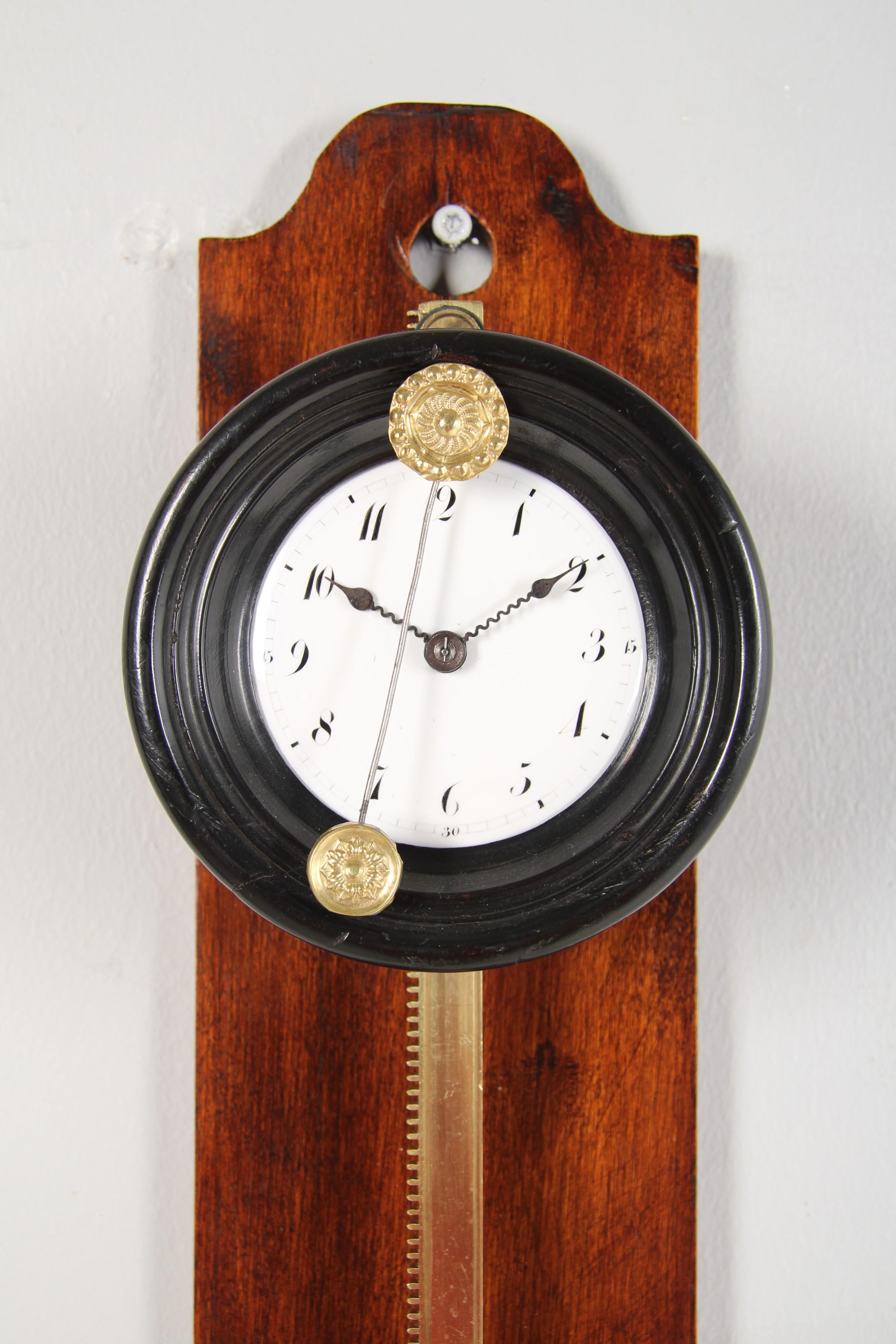 Rare antique saw clock

Denmark
Brass, enamel
dated: 1829

Dimensions: H x W x D: 46 x 13 x 8 cm

Description:
Very unusual and extremely rare gravity-driven wall clock suspended from a toothed moulding.

The brass bar is mounted on a board made of