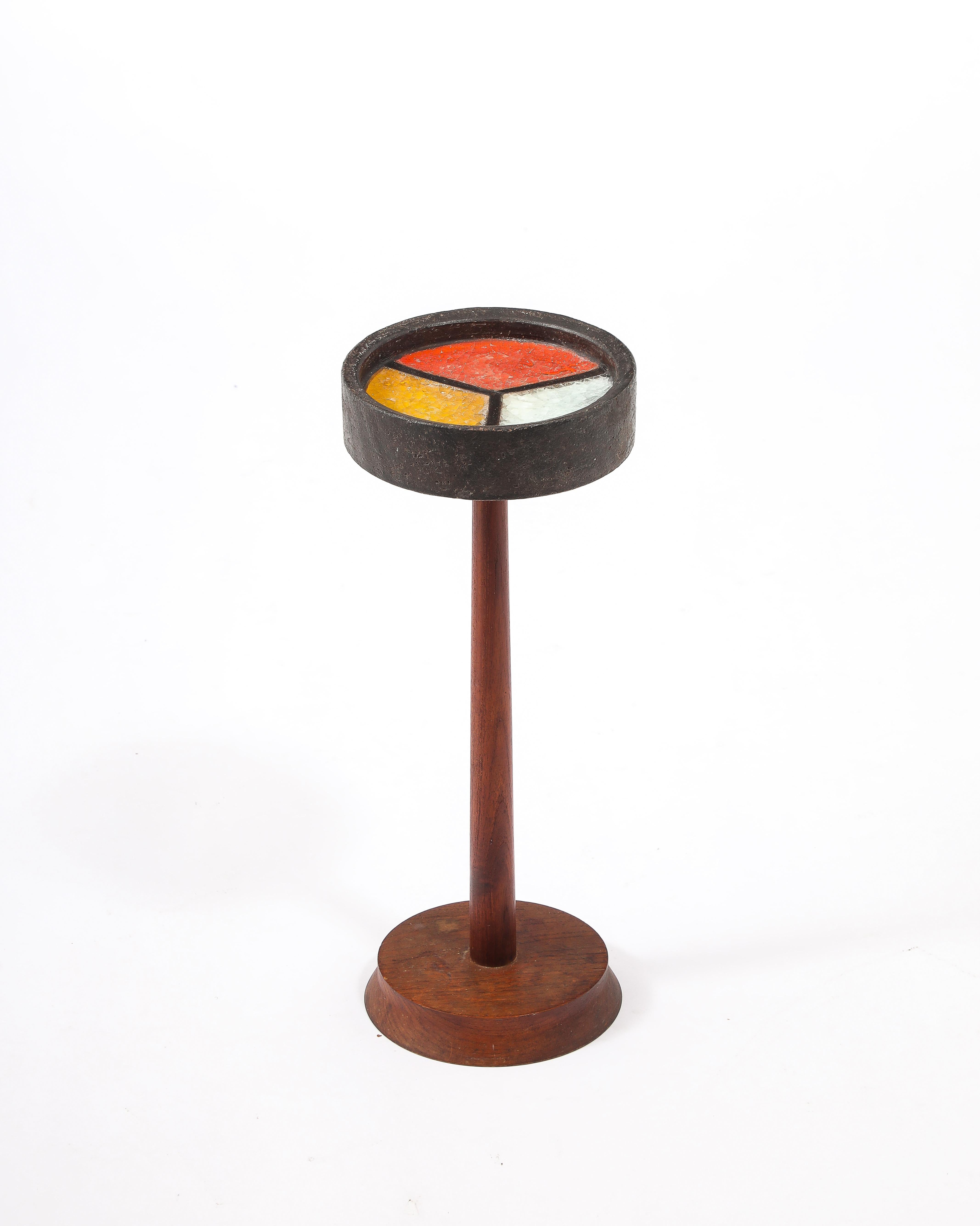 An amazing ceramic drink stand on a teak pedestal, the ceramic is filled with tricolors crackled fused glass, a process called “Fritte.”