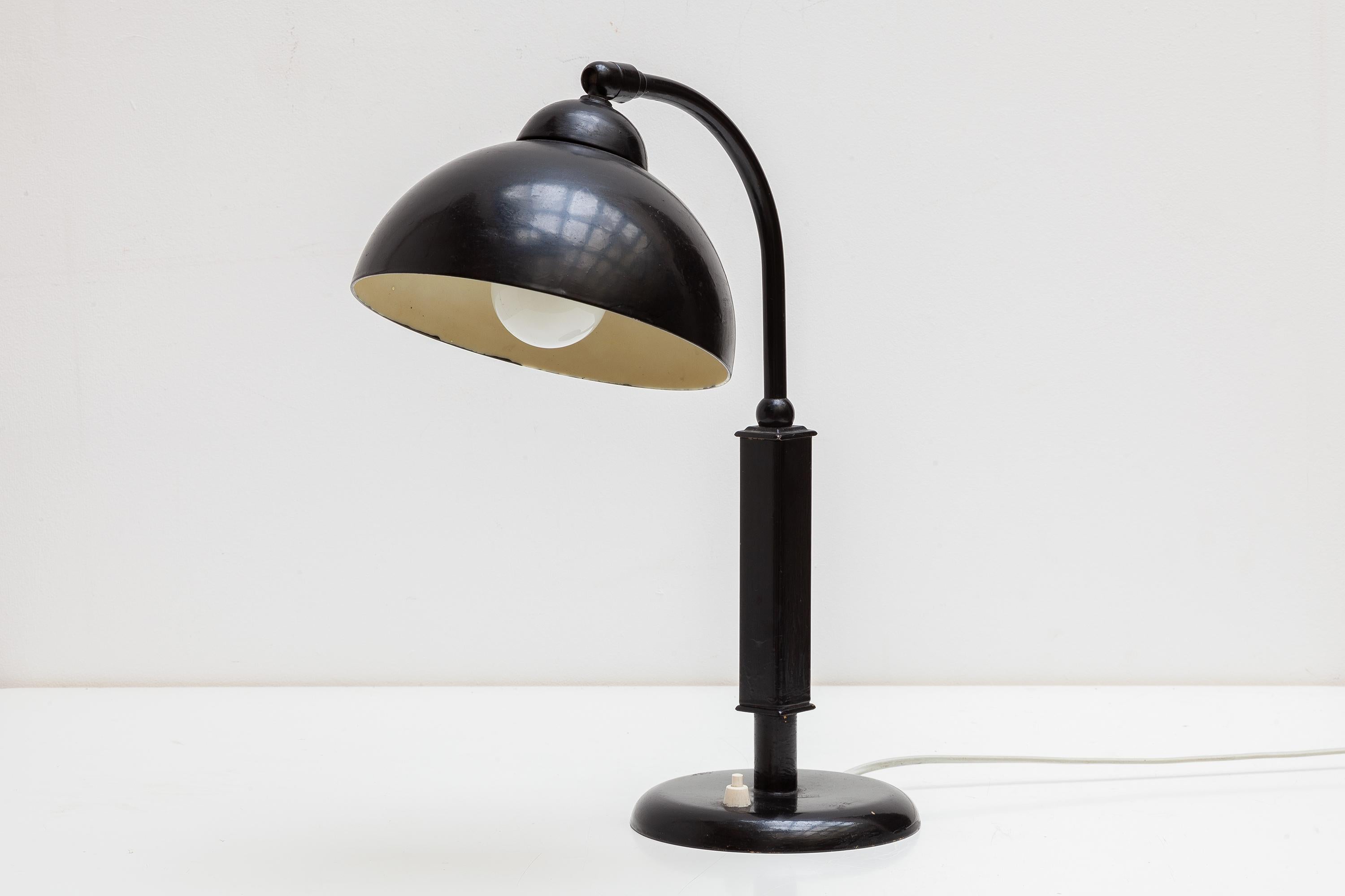 Bauhaus desk lamp in enameled black metal and bakelite shade. Adjustable swan neck. Lit by 1 bulb.Christian Dell Desk Lamp By Kaiser Idell Bauhaus, 1930s Design, 1934.Germany.