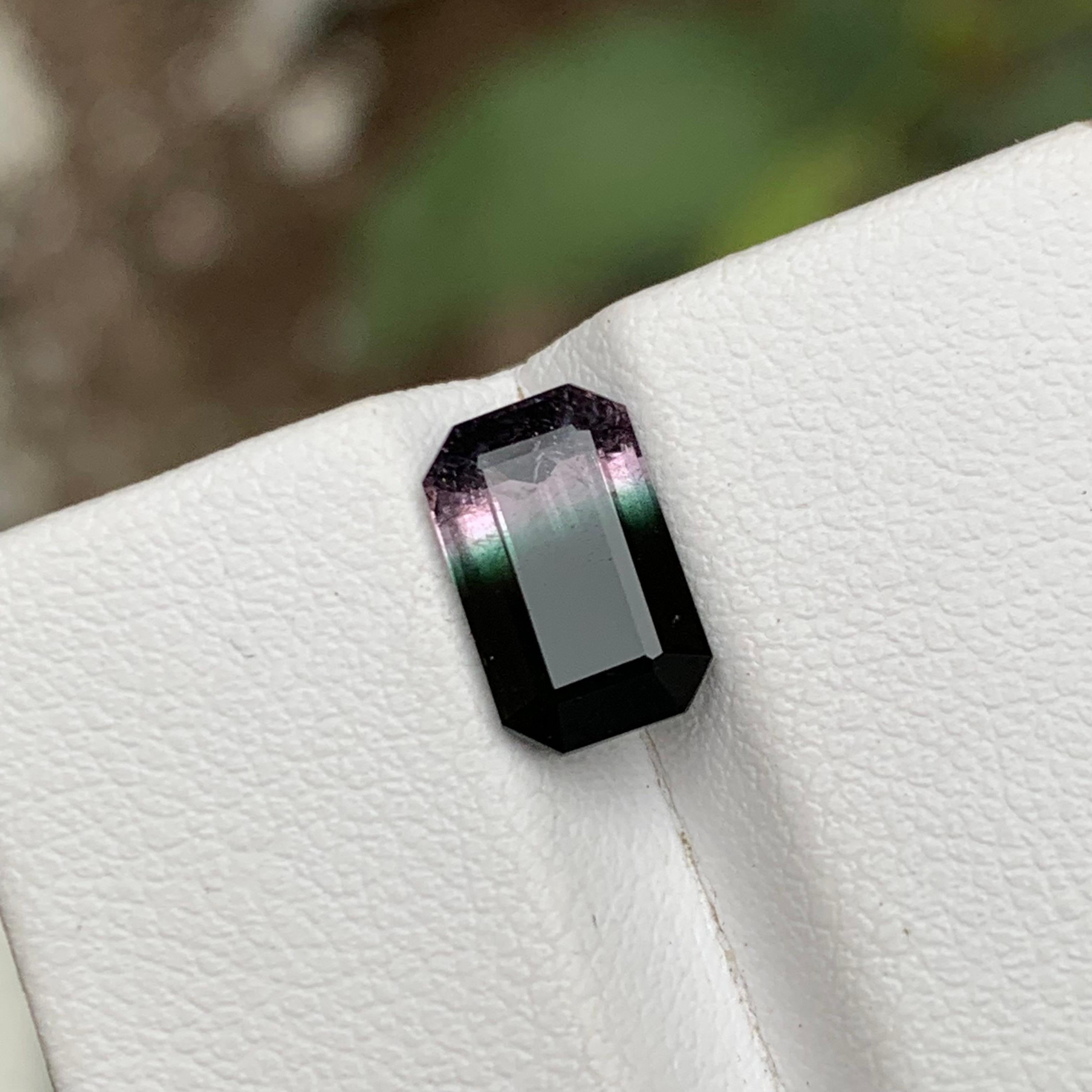 GEMSTONE TYPE: Tourmaline
PIECE(S): 1
WEIGHT: 2.10 Carats
SHAPE: Emerald Cut
SIZE (MM): 9.67 x 6.04 x 4.07
COLOR: Tricolor
CLARITY: Slightly Included 
TREATMENT: None
ORIGIN: Afghanistan
CERTIFICATE: On demand

Extraordinary 2.10 Carats Black,