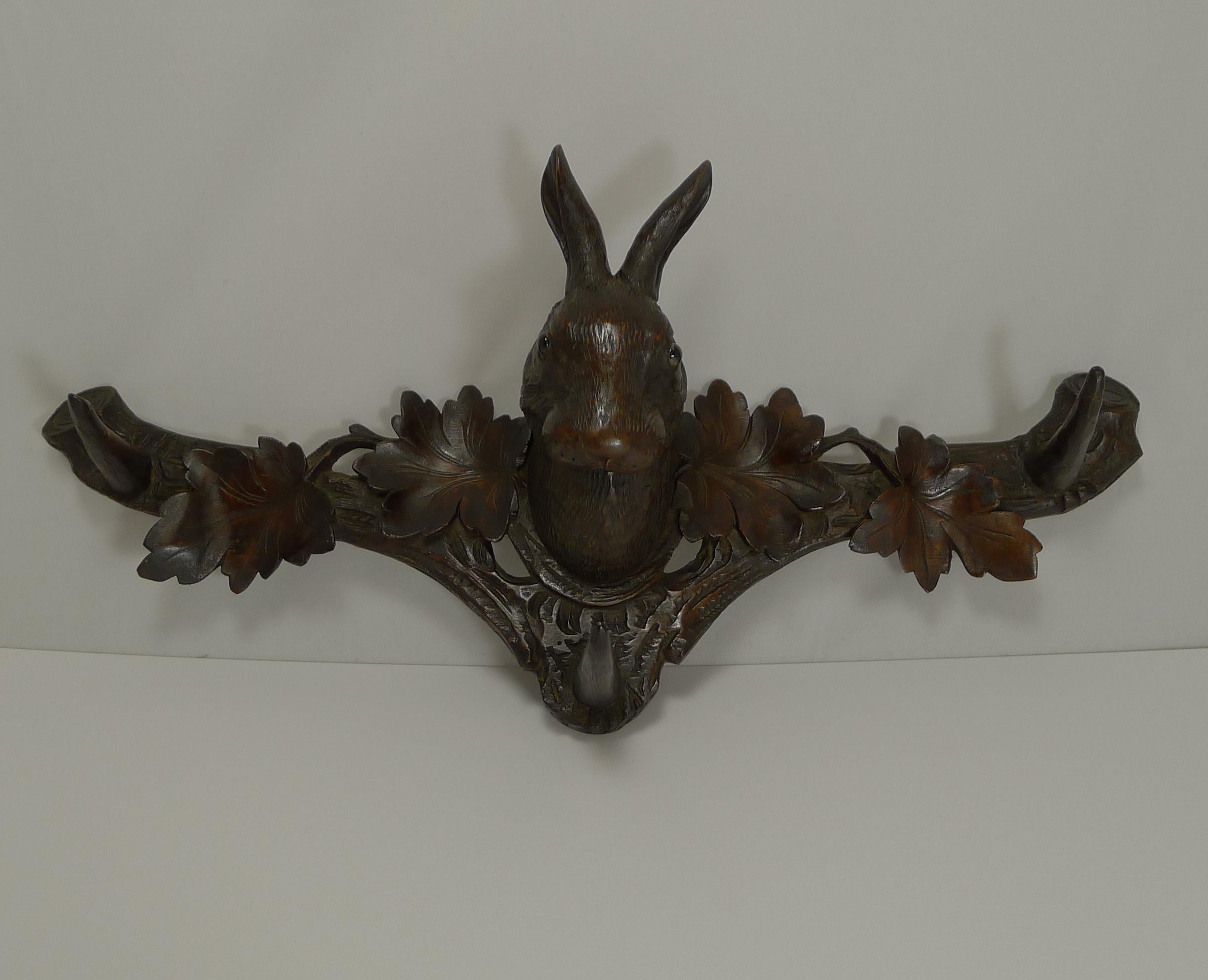 A fabulous wall hanging rack, beautifully hand-carved in the Black Forest region, circa 1890.

Of course what makes this so charming and collectible is the wonderful carved Hare or Rabbit to the middle, beautifully executed sporting his two glass