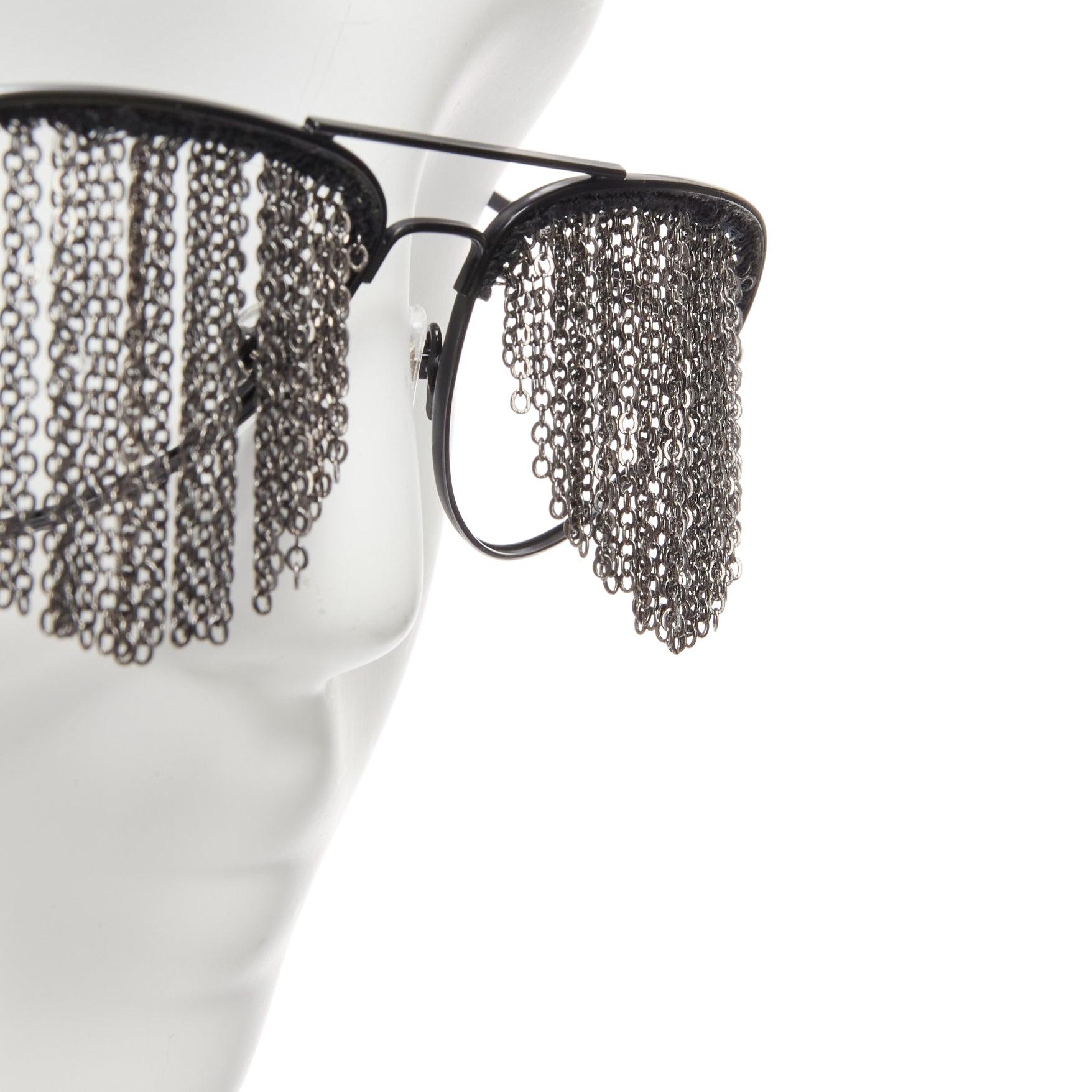 rare BLESS Duo Fringe black chain no lens aviator sunglasses
Reference: TGAS/D00713
Brand: Bless
Model: Duo Fringe
Material: Metal
Color: Black
Pattern: Solid
Closure: Pull On
Lining: Black Metal

CONDITION:
Condition: New with defects. One chain at